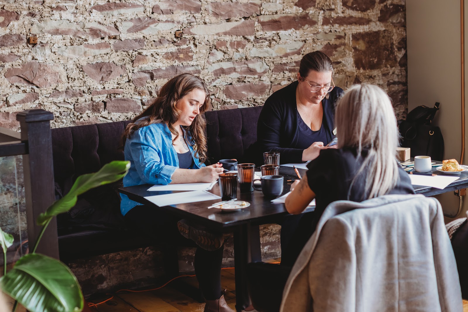 Collab Culture members sharing stories around a table