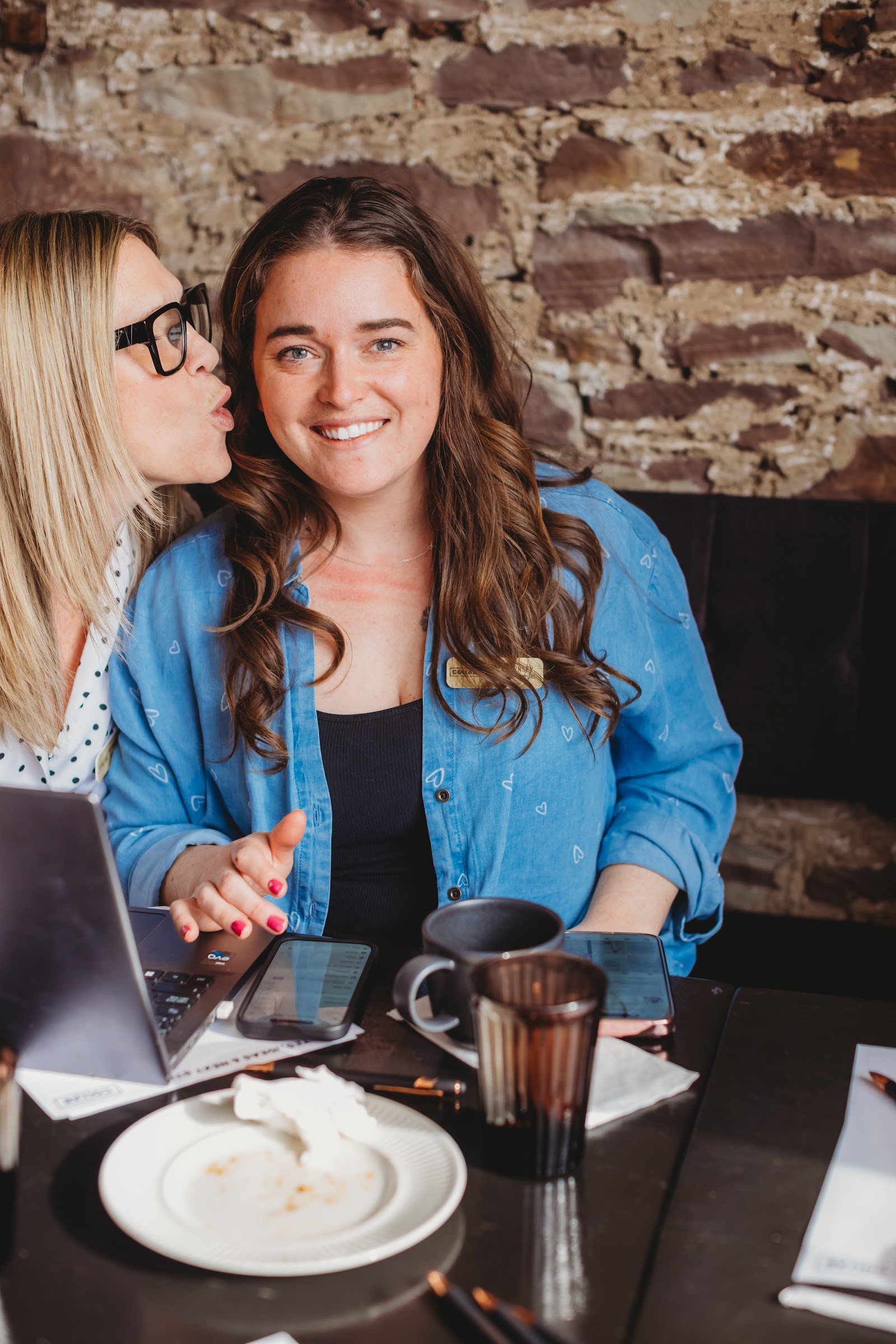 Two women exchanging business referrals at a Collab Culture event