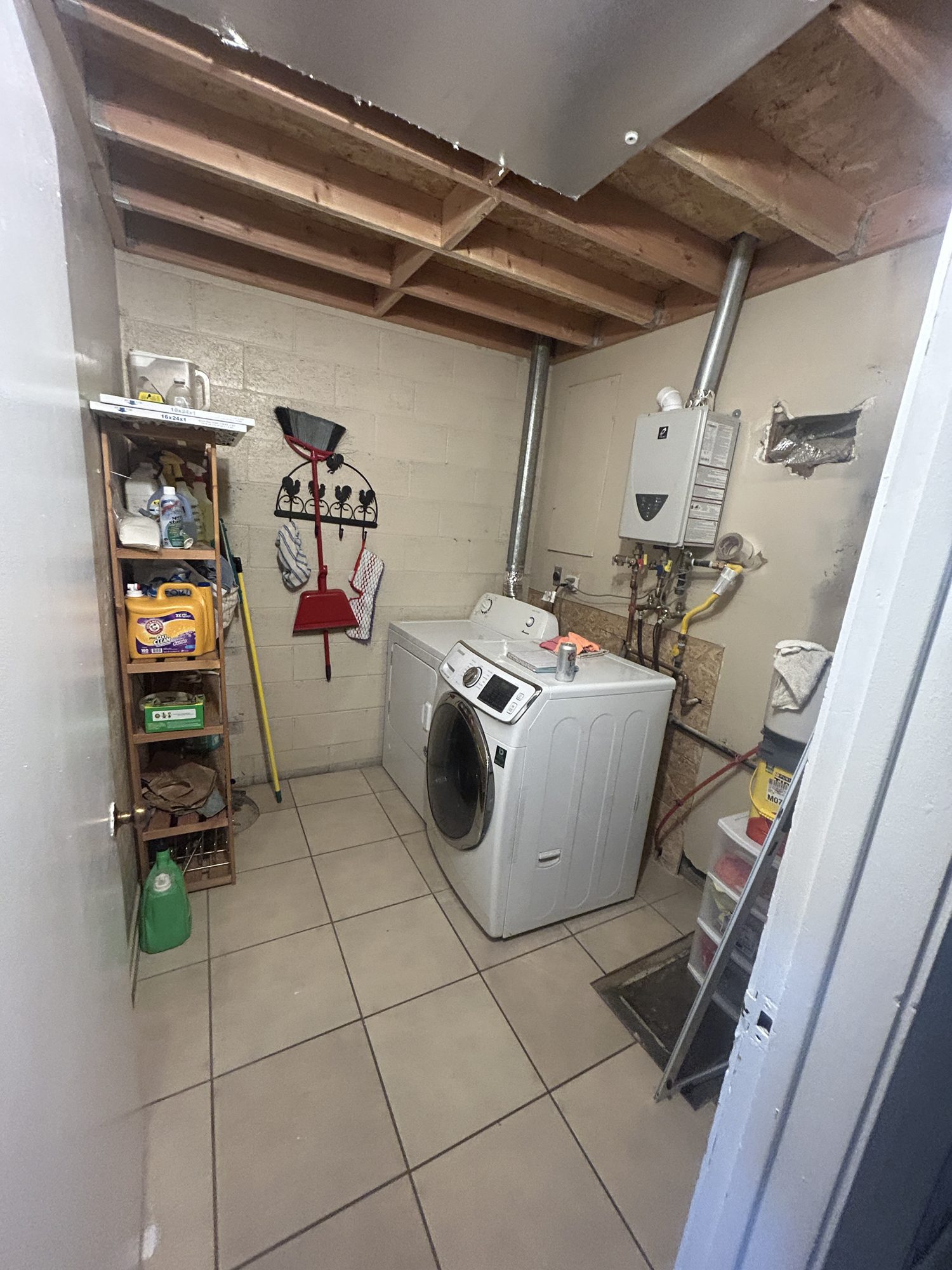 Original laundry room layout and utility area before conversion to finished nook, Reno, NV