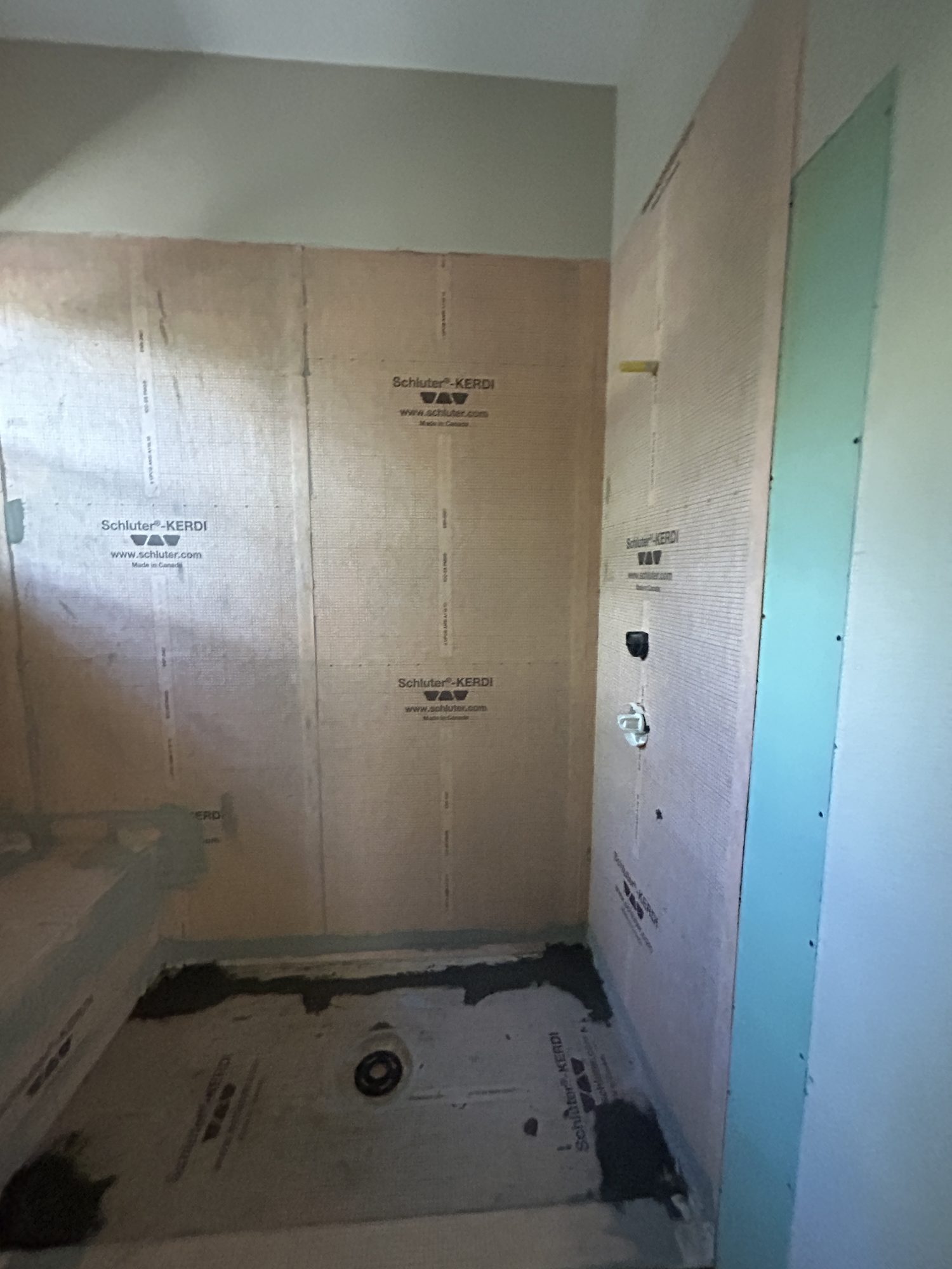 Schluter-KERDI waterproofing membrane bonded across walls and pan, Reno, NV