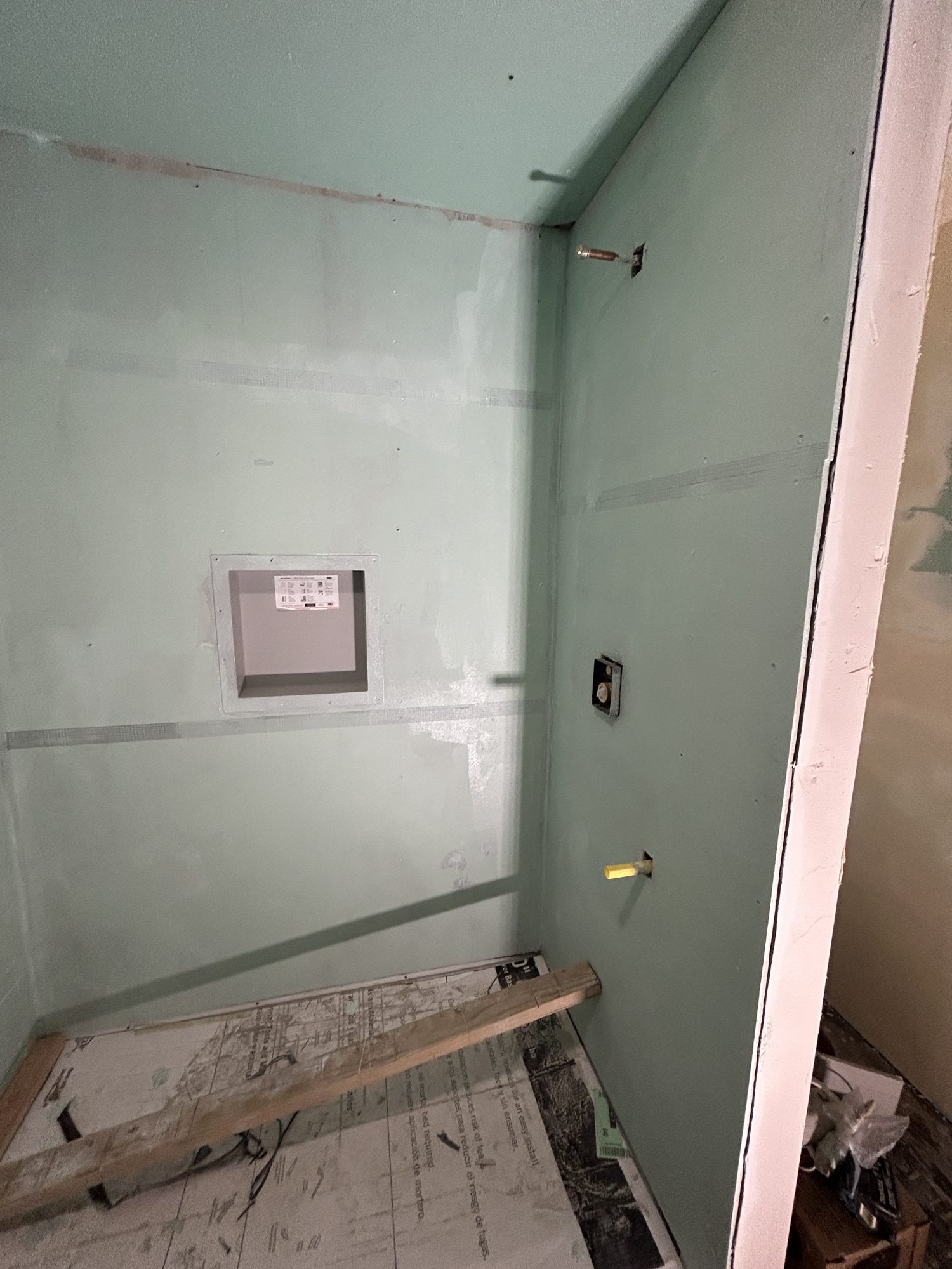 Framed shower pan and taped green-board backing ready for waterproofing, Reno, NV