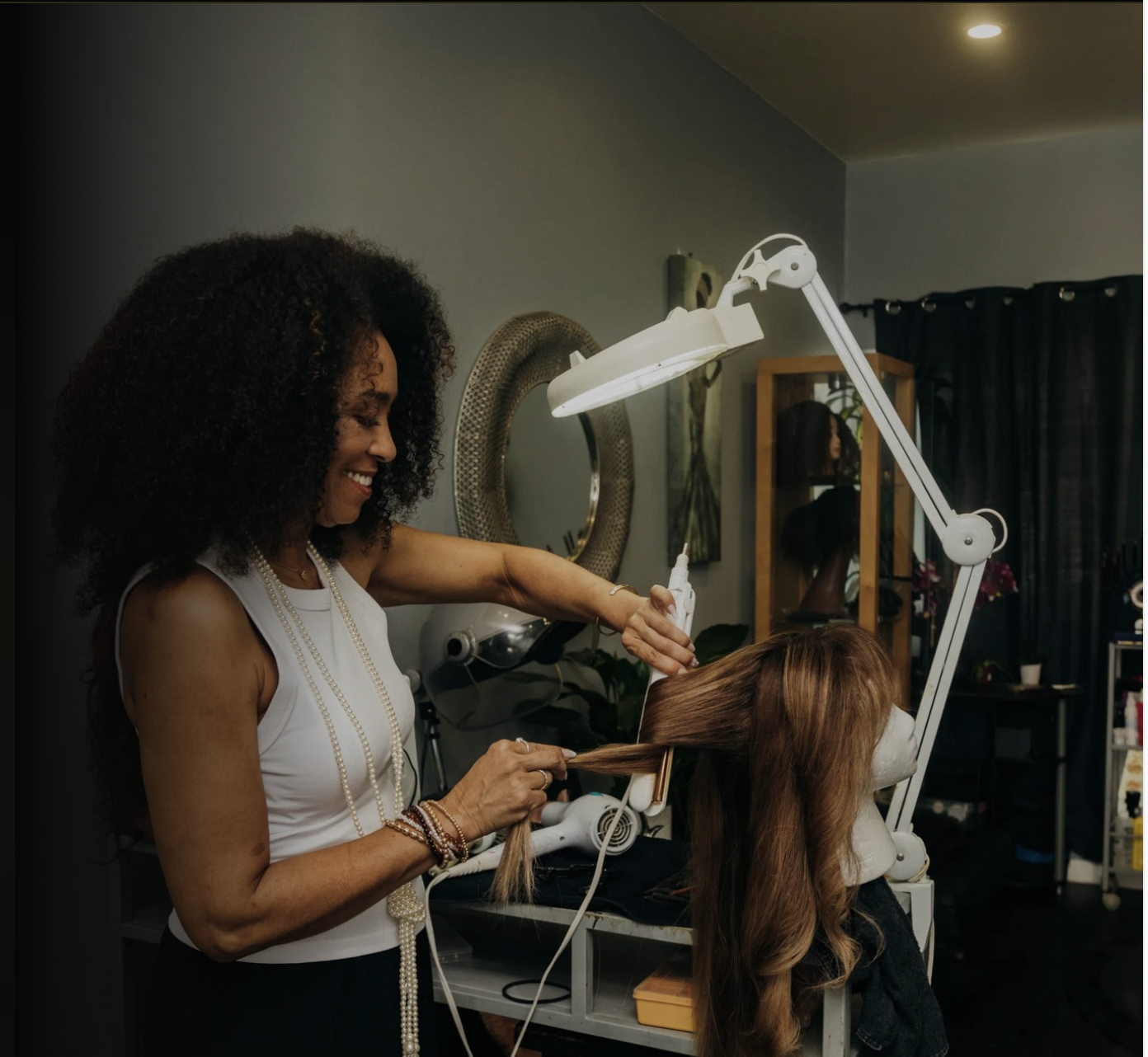 Kathleen Secrets Luxury Wig Specialist styling a unit