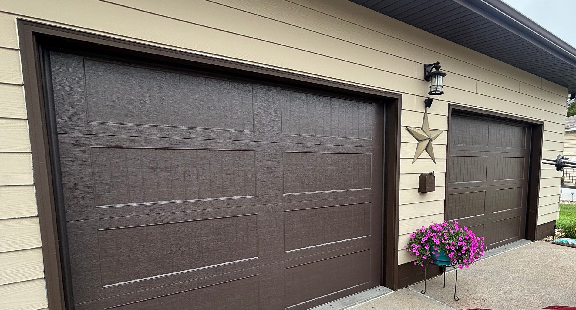 Brown carriage style garage doors, Nelson Garage Solutions