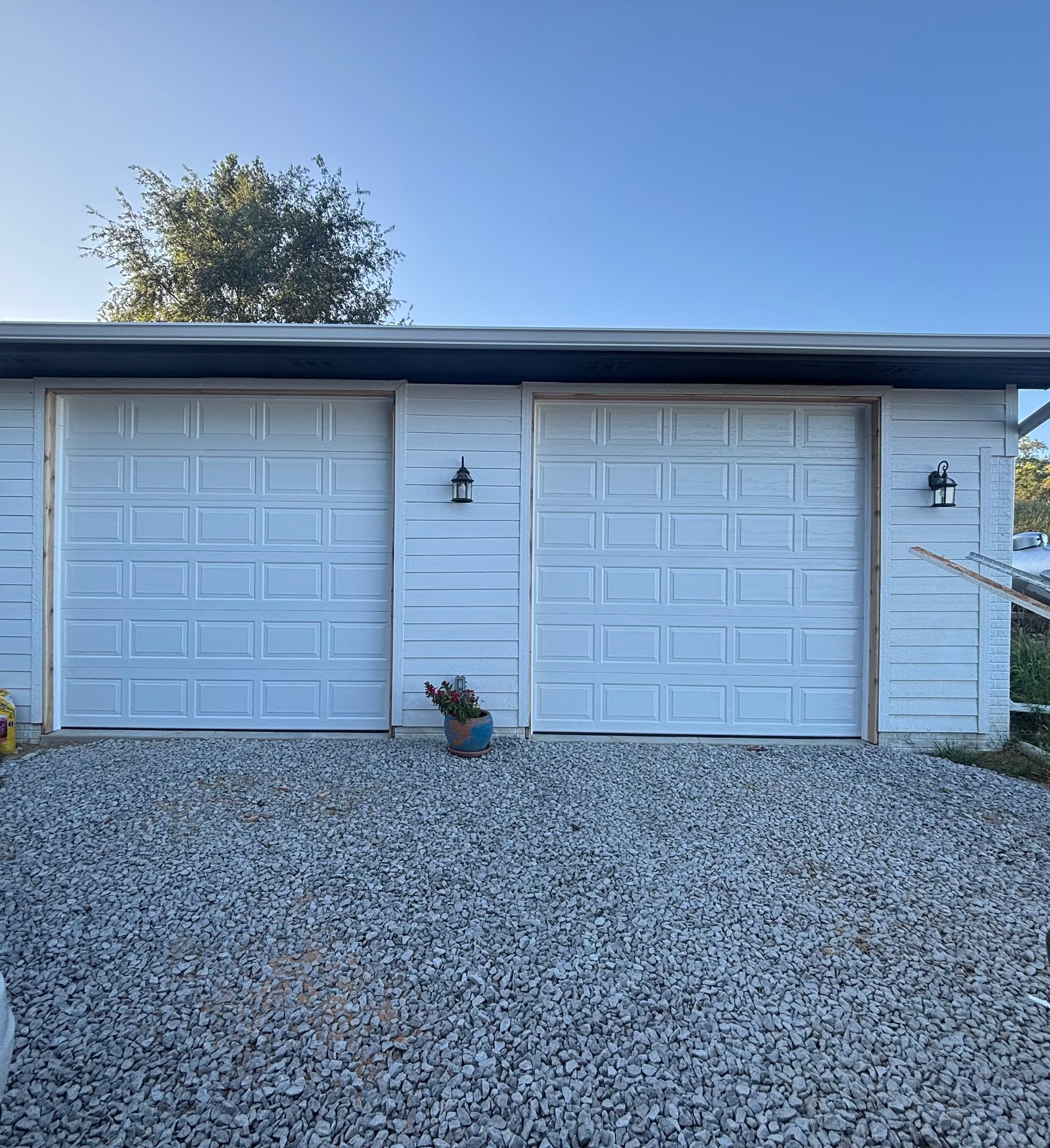Pair of white raised panel garage doors, Nelson Garage Solutions