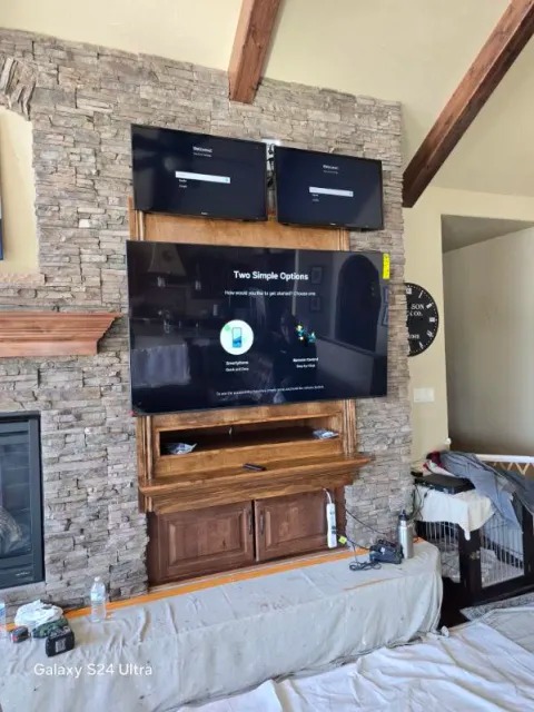 Custom stone fireplace and media wall remodeling project by Absolutely Construction in Colorado