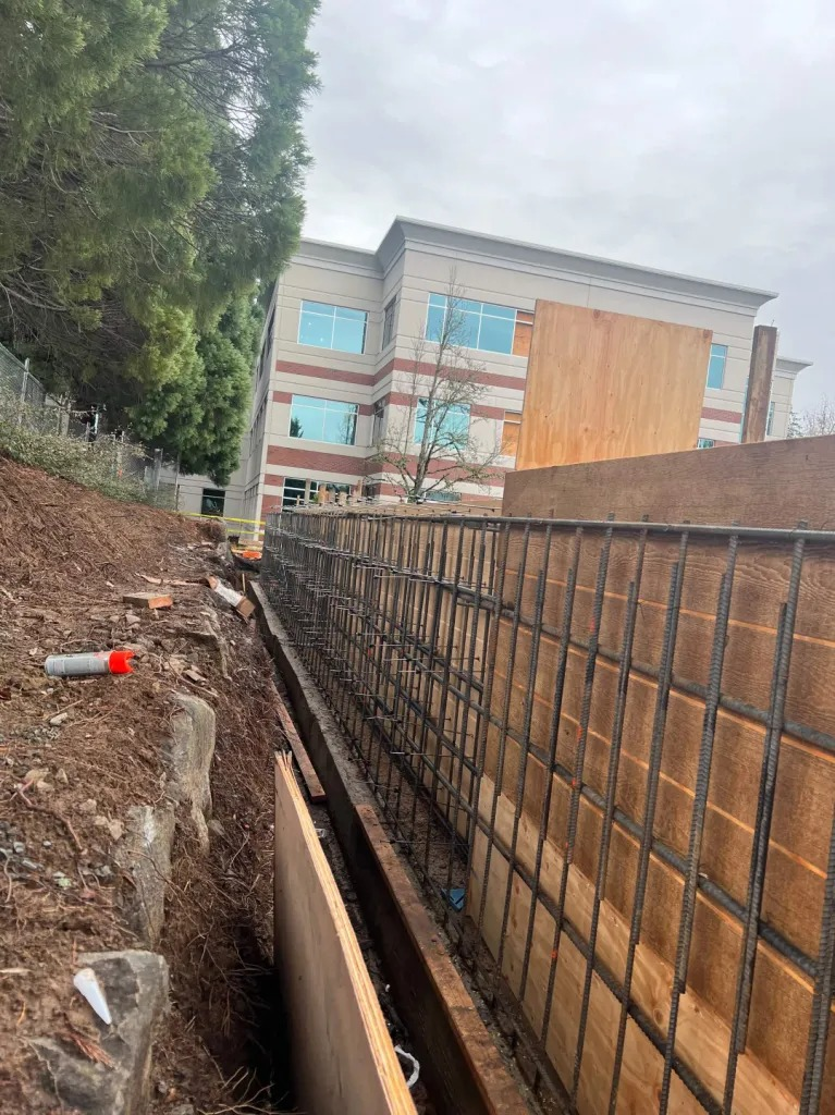 Jesus Castaneda working on a decorative concrete wall