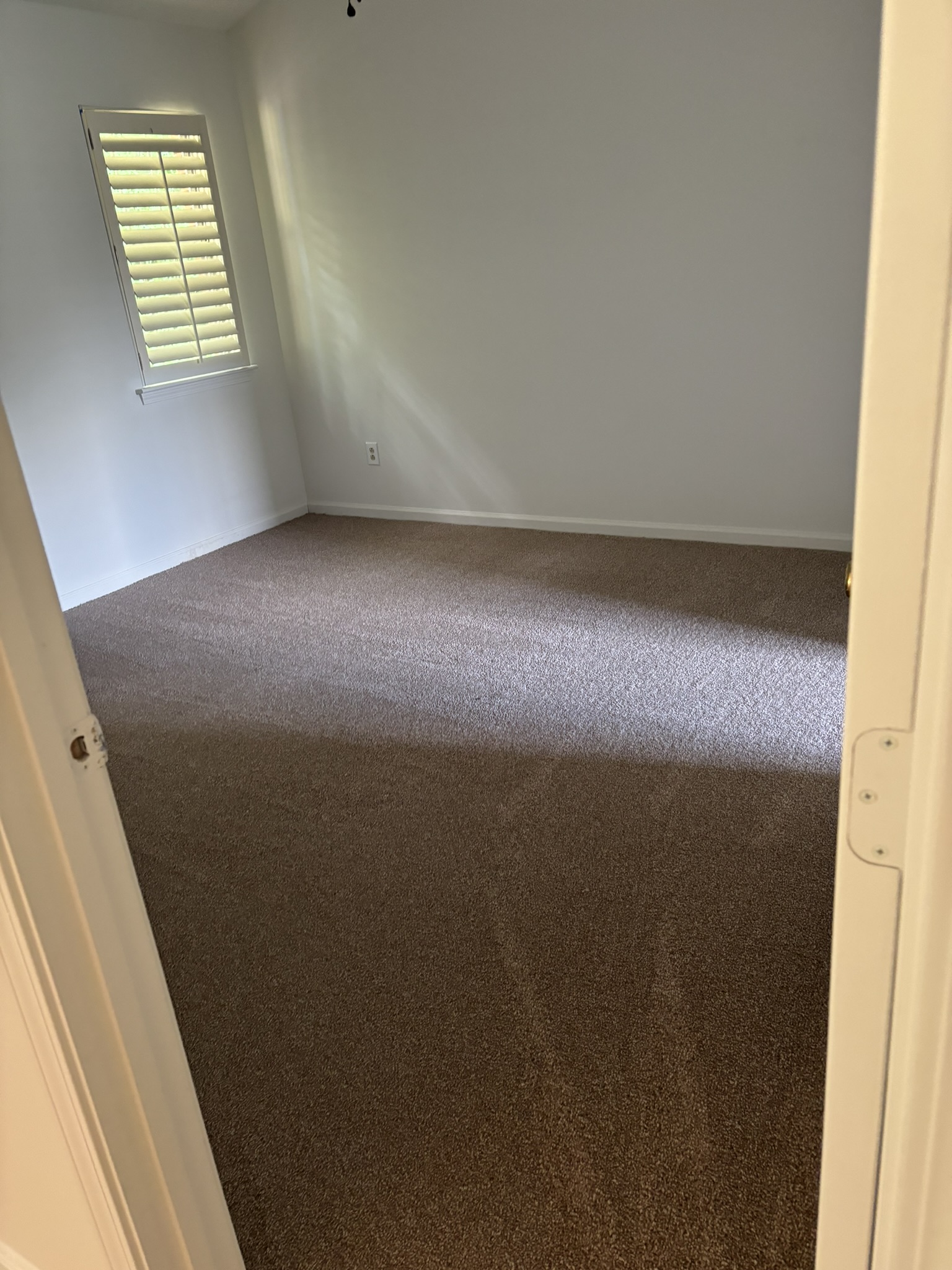 Freshly Vacuumed Bedroom Carpet & Baseboards
