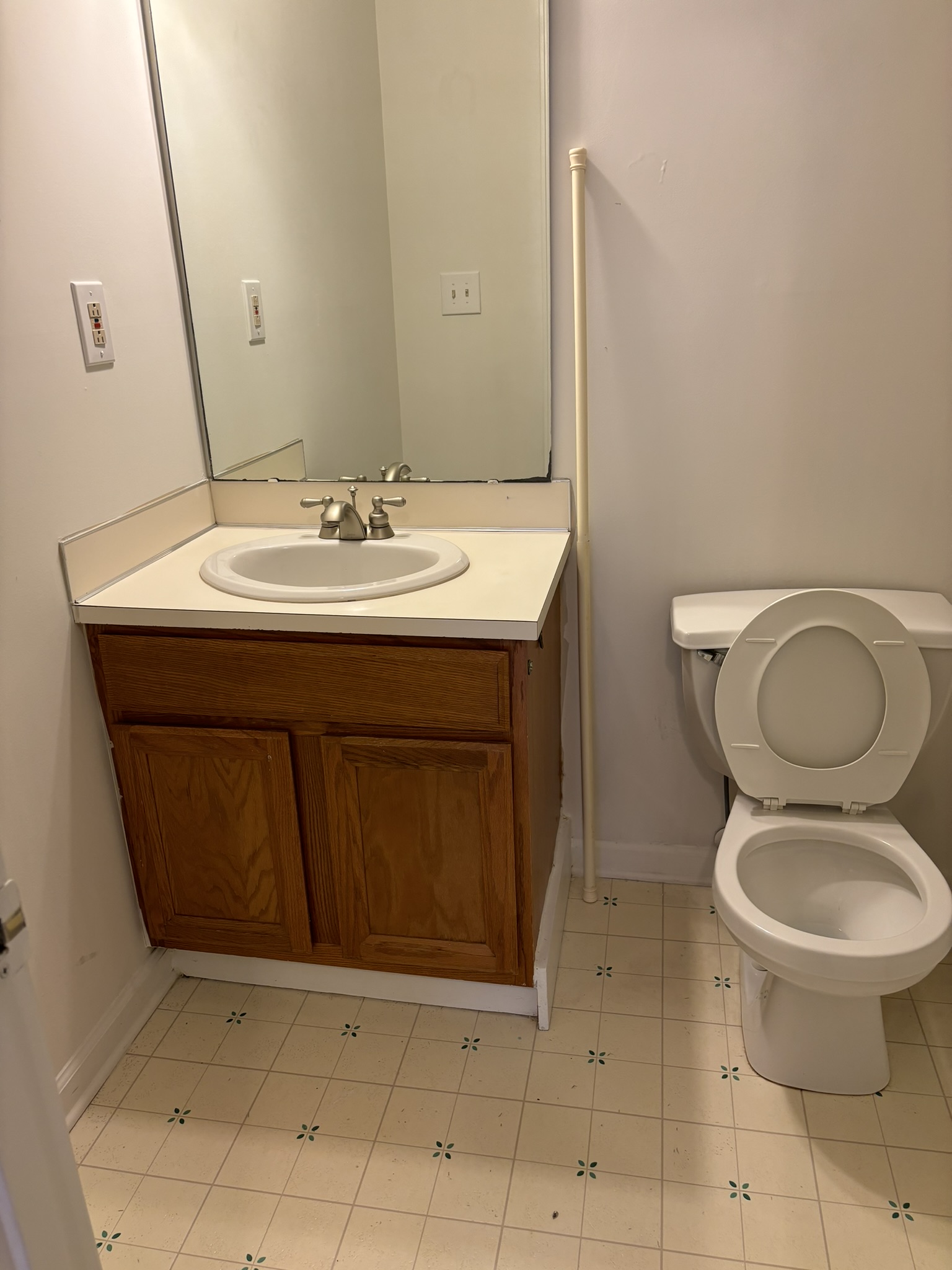 Sanitized Half-Bath Oak Vanity & Tile Floor
