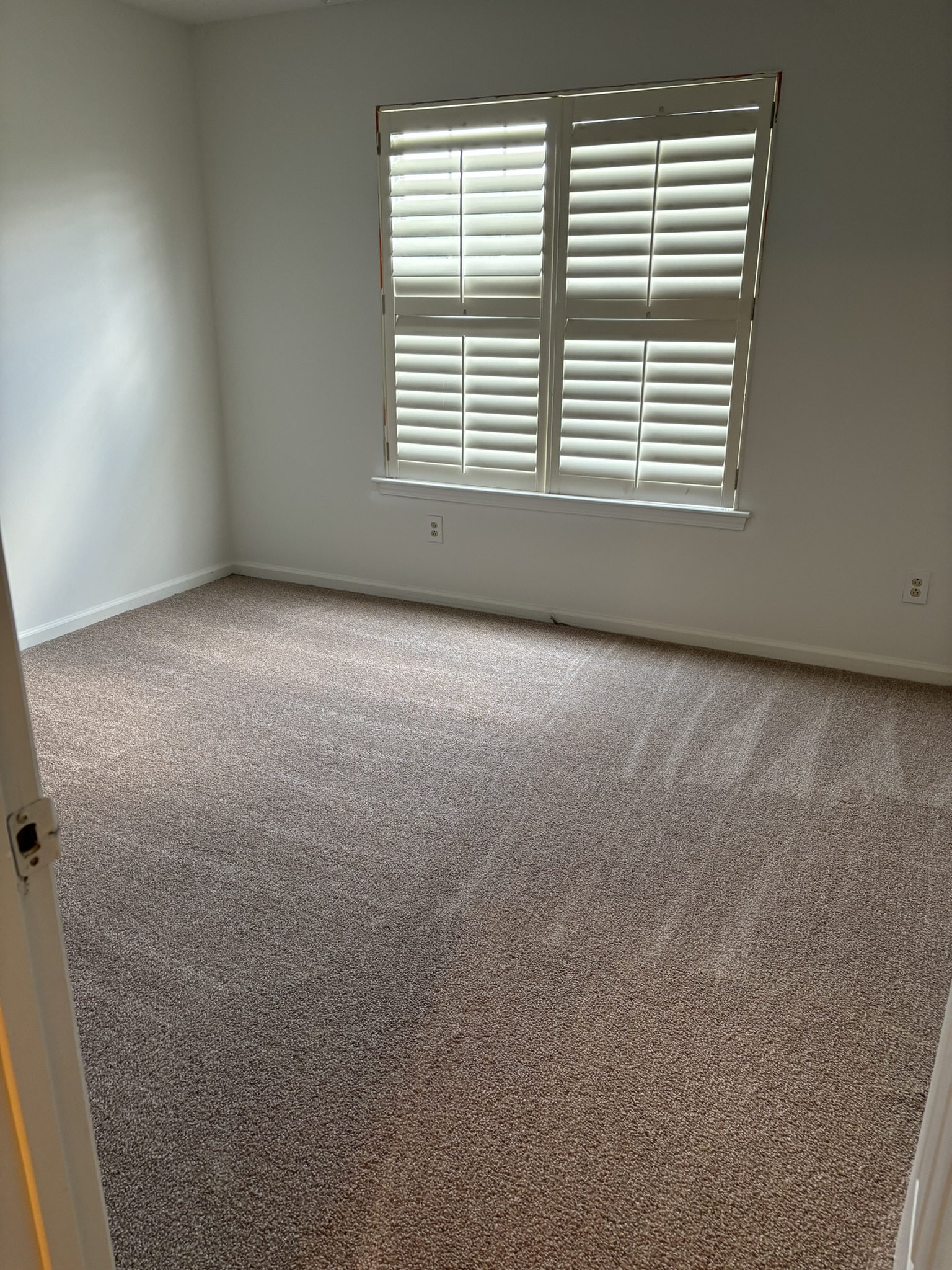 Vacuumed Bedroom Carpet & Plantation Window Shutters