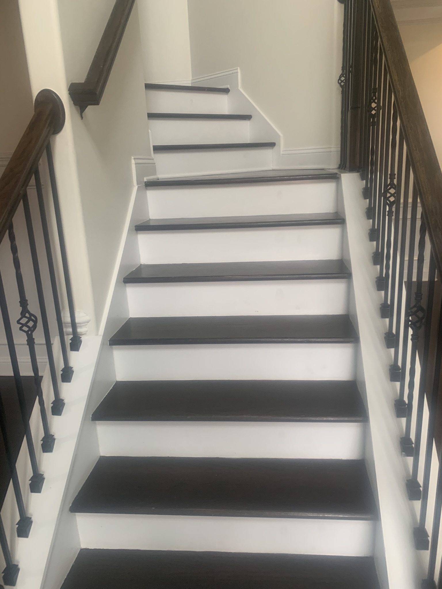 Two-Tone Hardwood Staircase & Wrought Iron Balusters