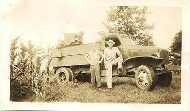 Original founders Edgar Bond and his son Charles Bond by their work truck