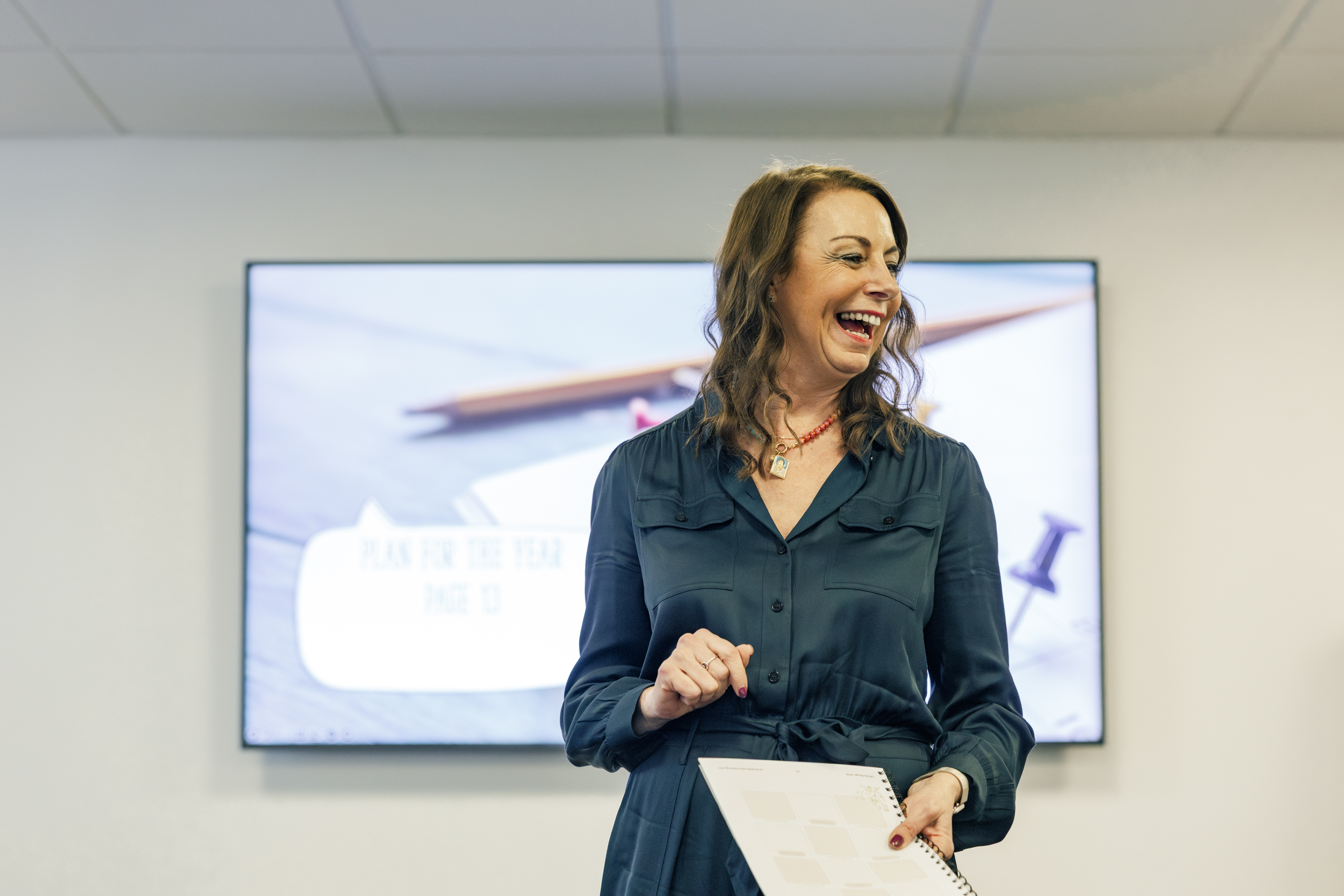 Amanda speaking and laughing with women at Upgrade Club