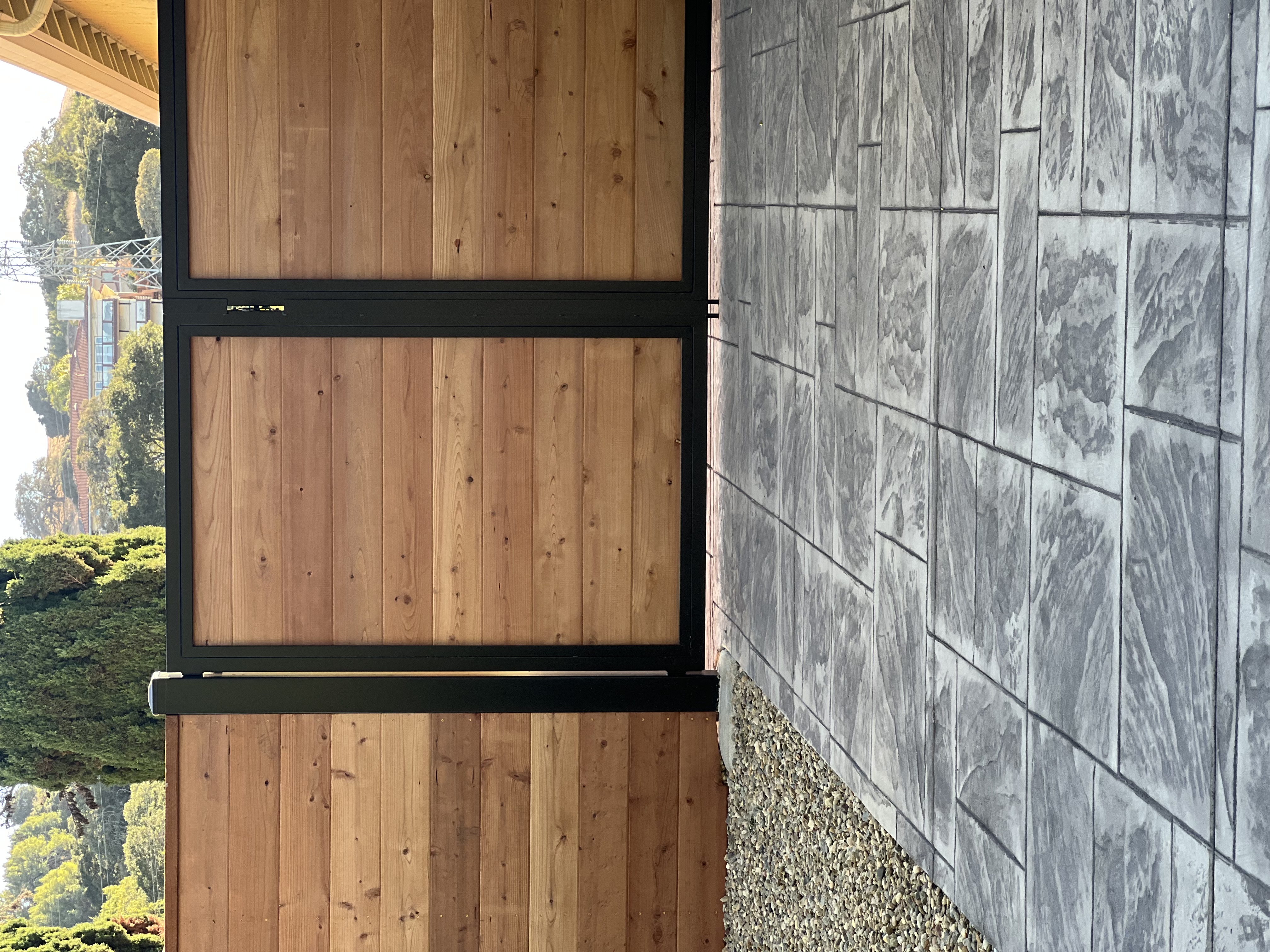 Black Steel Framed Wood Privacy Gate & Paver Patio