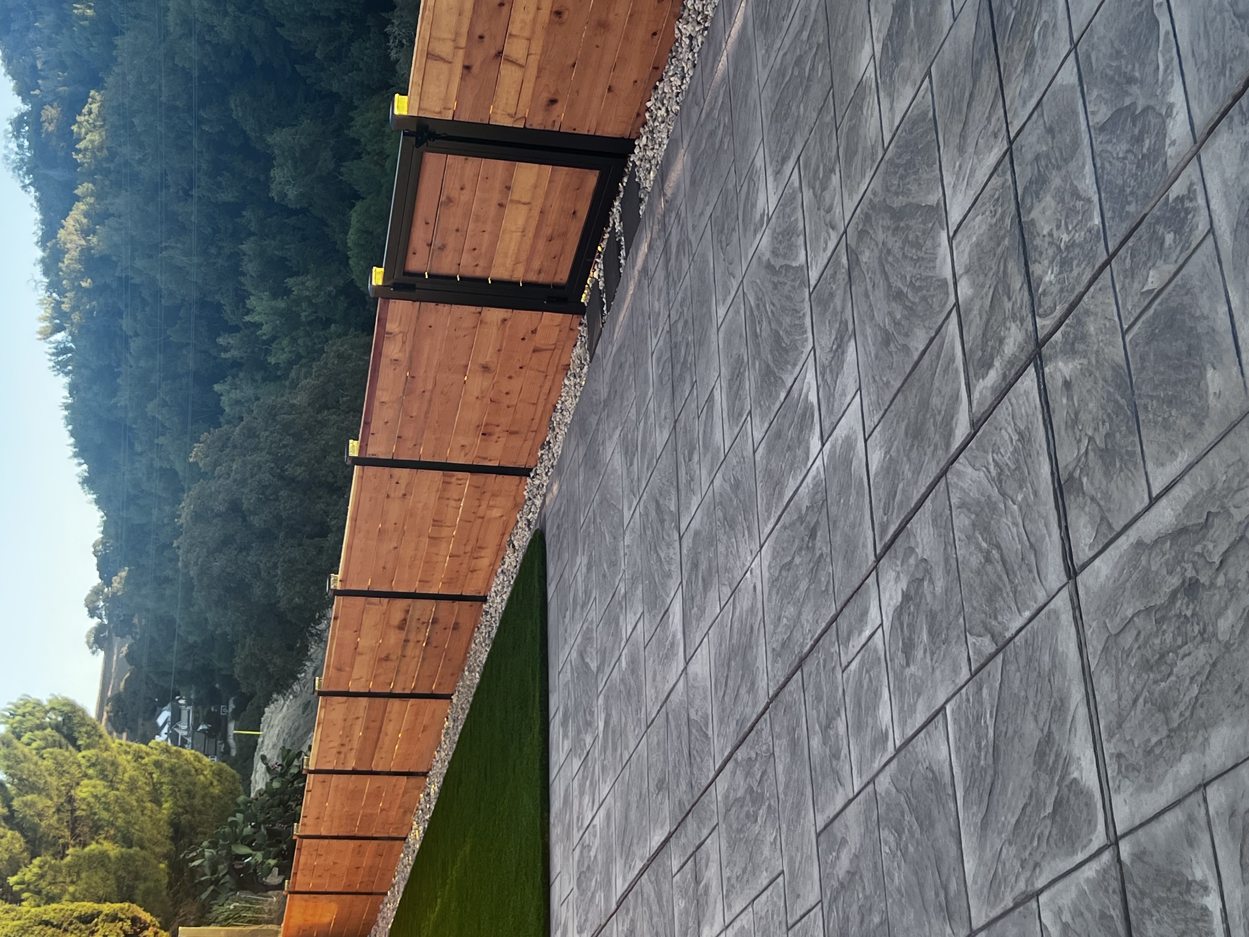 Horizontal Redwood Fence with Black Steel Posts