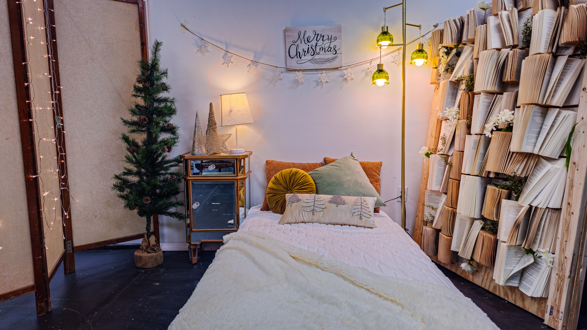 Opulent holiday film studio set with a grand frosted Christmas tree