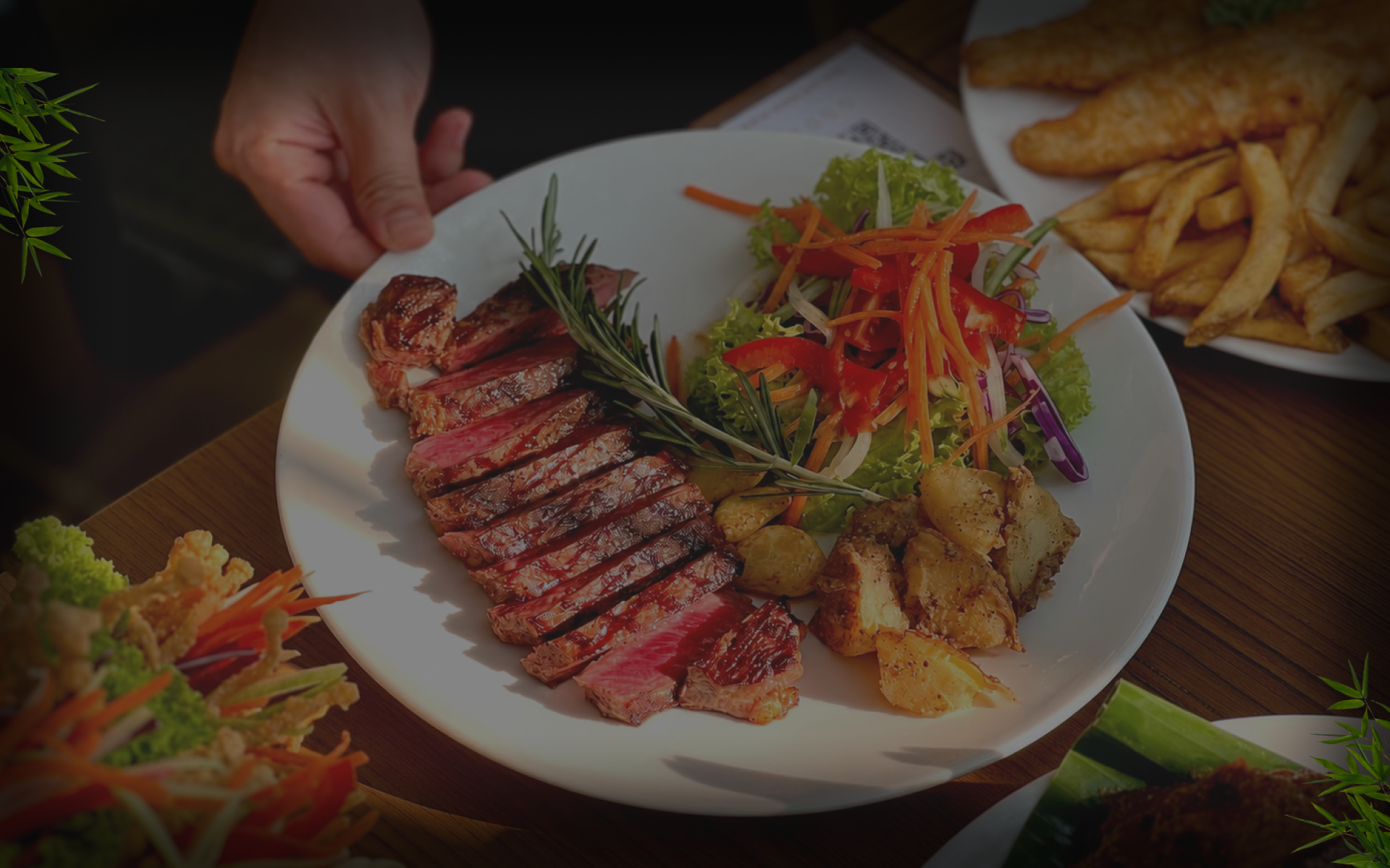Atas Restaurant signature medium-rare steak, garden salad and roasted potatoes