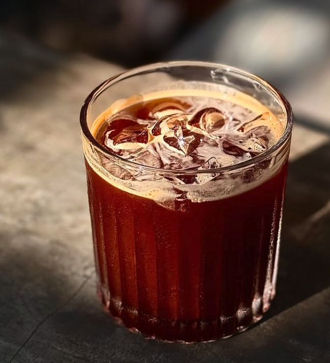 Atas handcrafted iced coffee in crystal glass