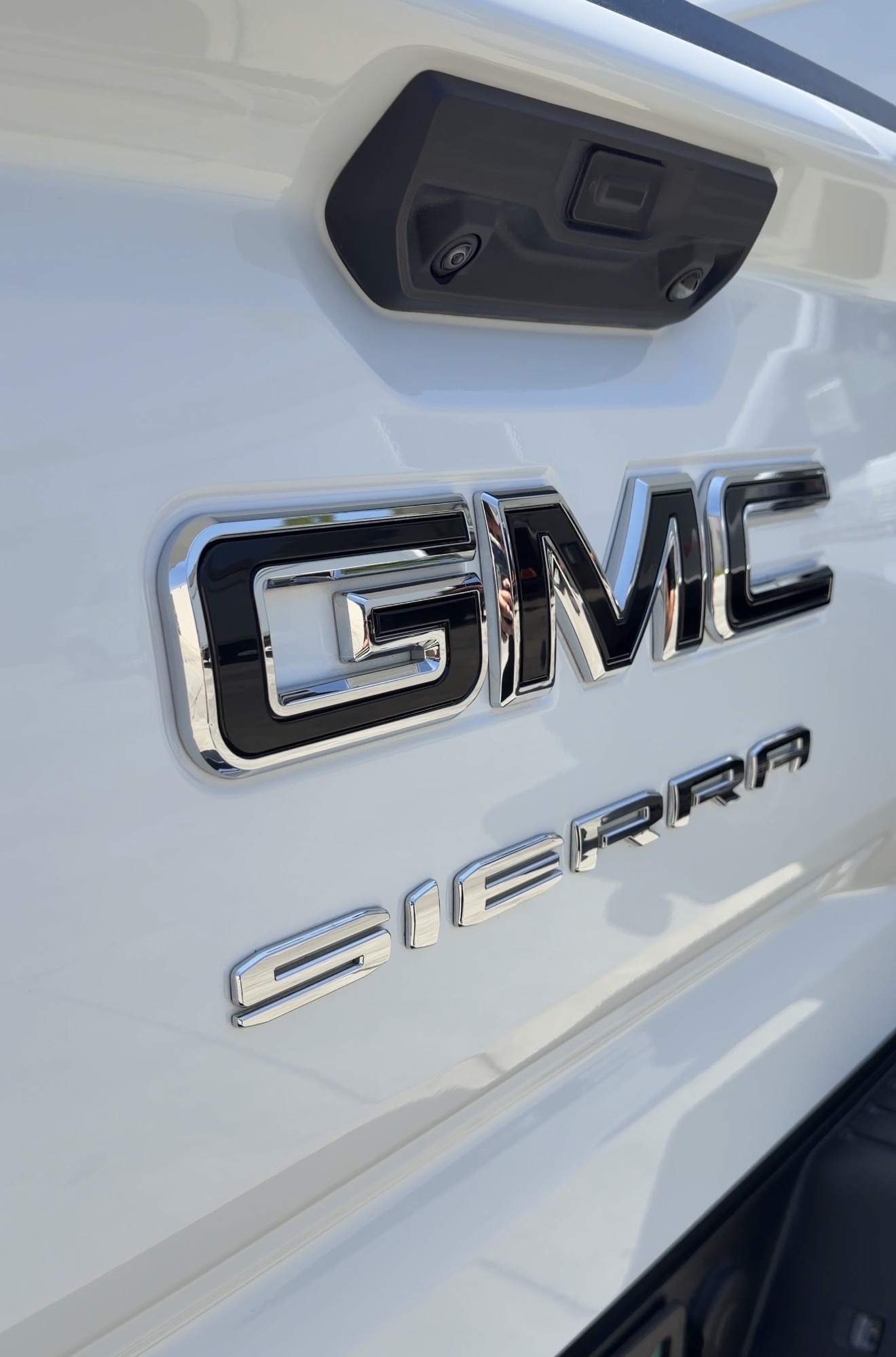 Spotless chrome GMC Sierra emblem after precision detail