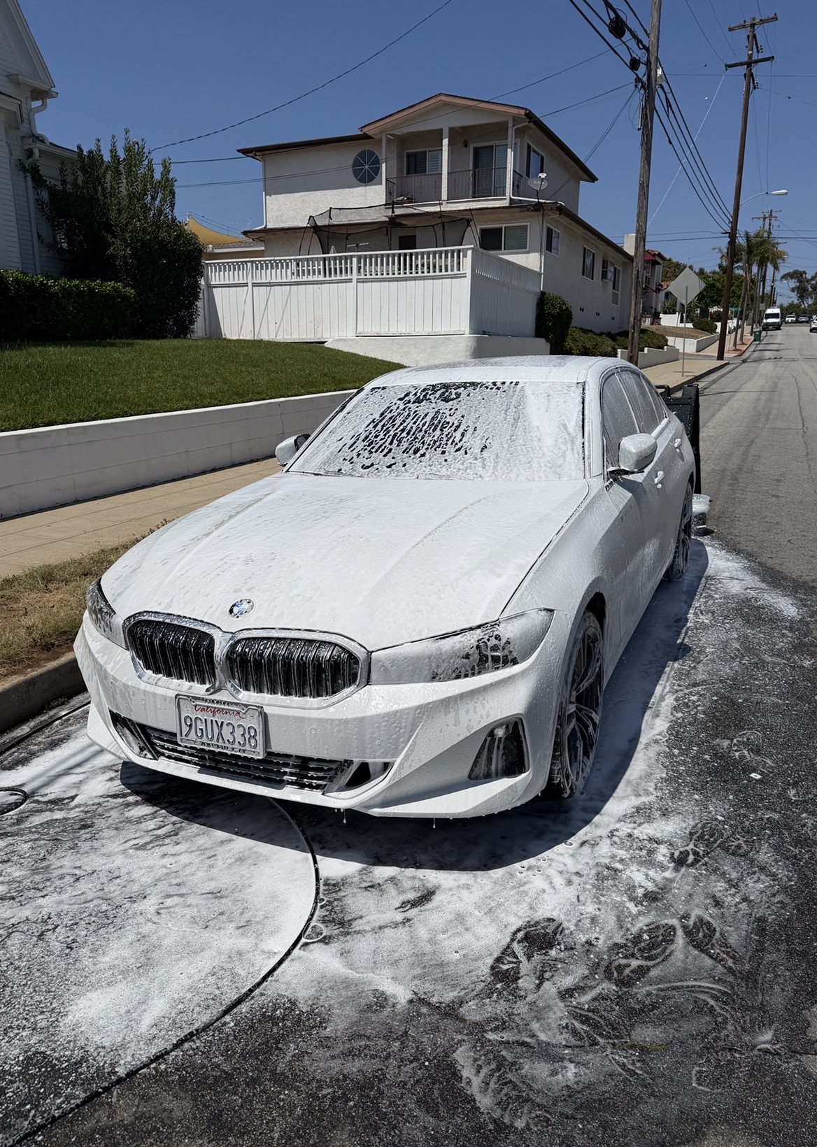 BMW 3 Series covered in foam cannon pre-wash