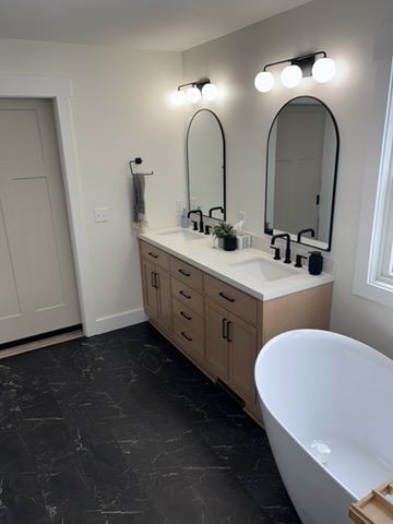 Primary bathroom with painted walls and crisp white trim