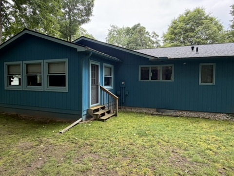 Upscale Northern Michigan home with freshly painted exterior siding and trim