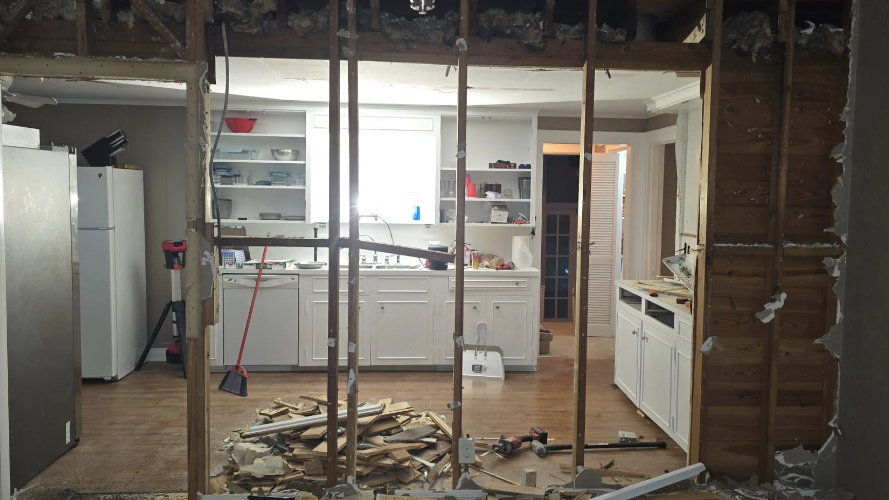 Interior wall opening and drywall prep for open floor plan update