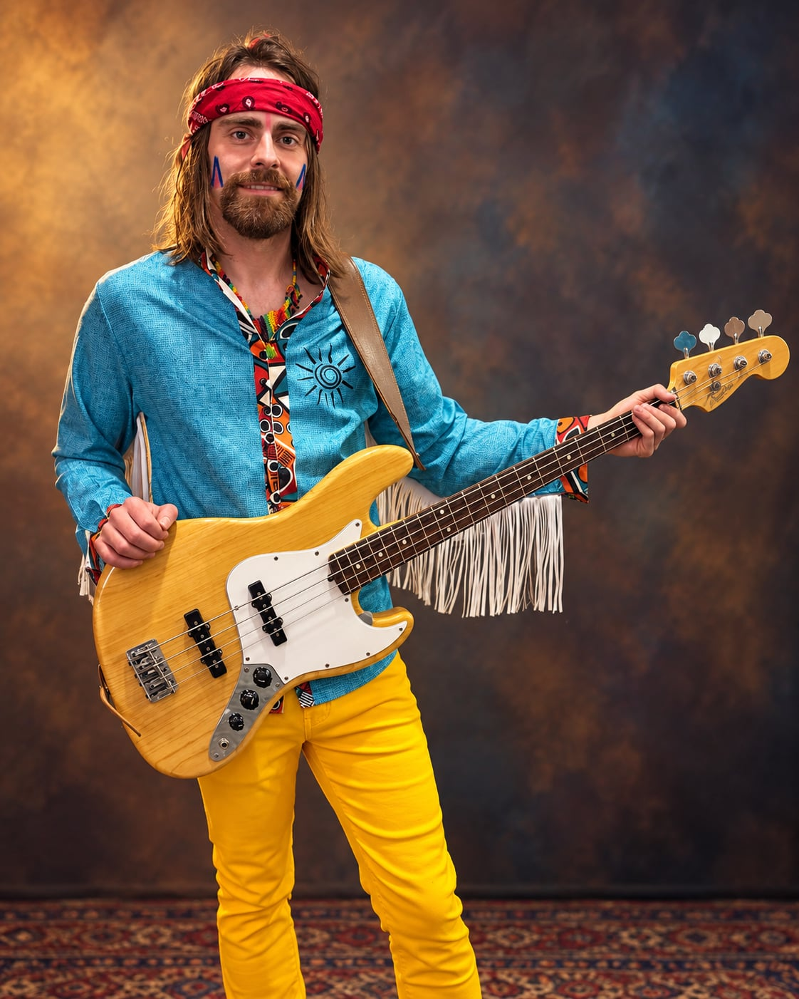 Bass Hawk, bassist of The New Indians Showband in blue stage shirt and red headband holding electric bass