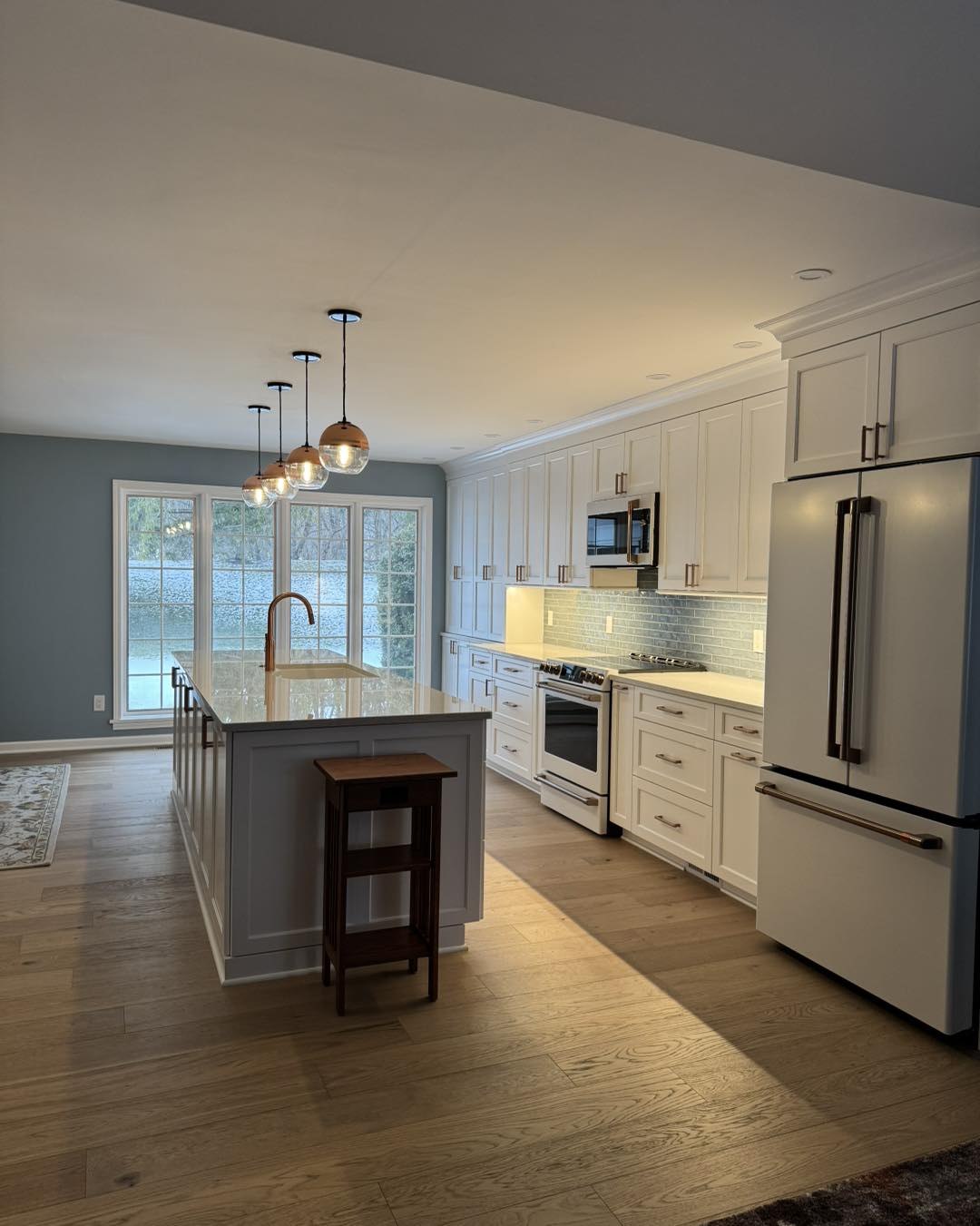ProPeak Remodeling Custom Kitchen Remodel with Large Island and Hardwood Flooring
