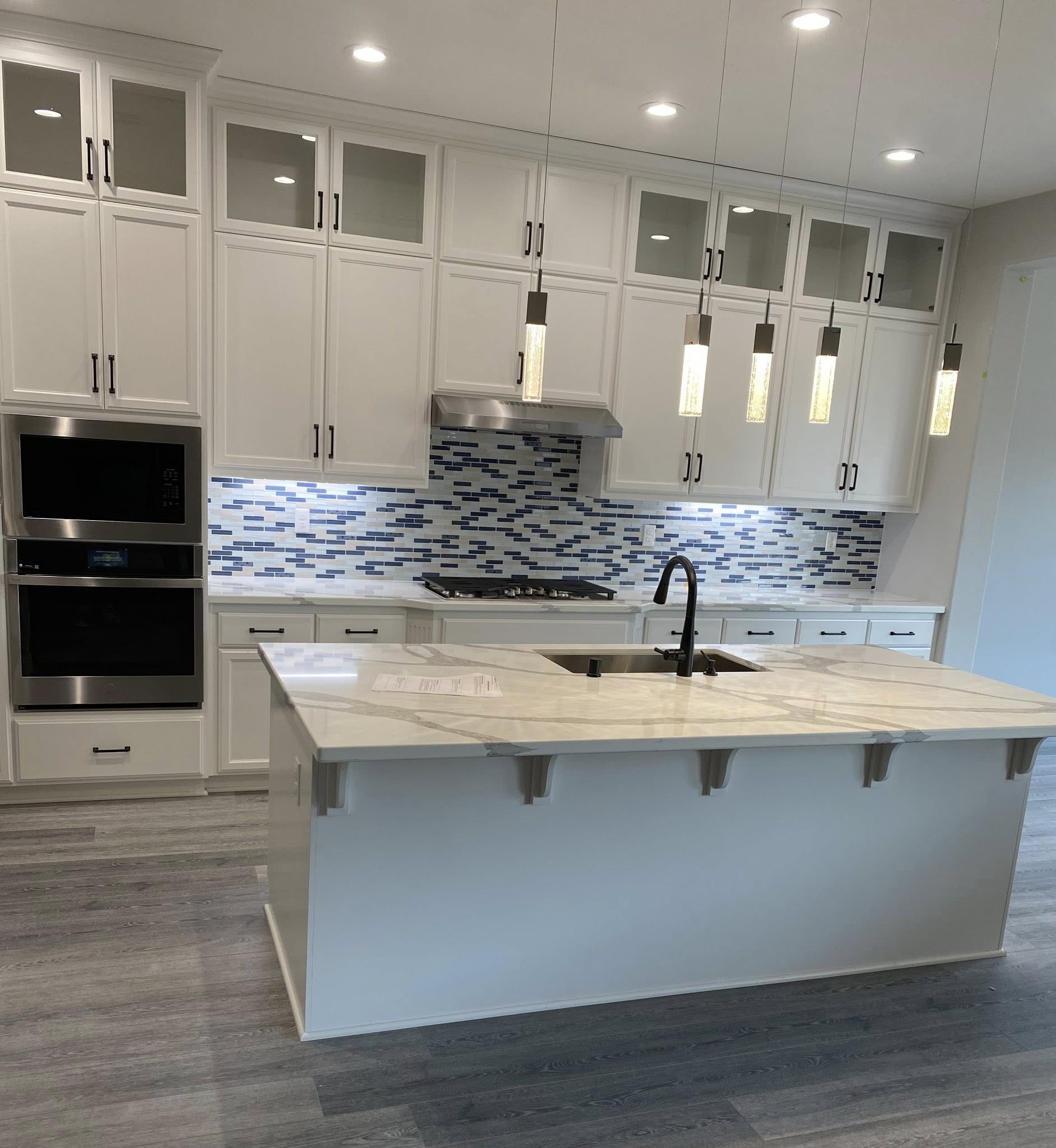 ProPeak Remodeling Premium Custom Kitchen with Marble Island and Glass-Front Cabinetry