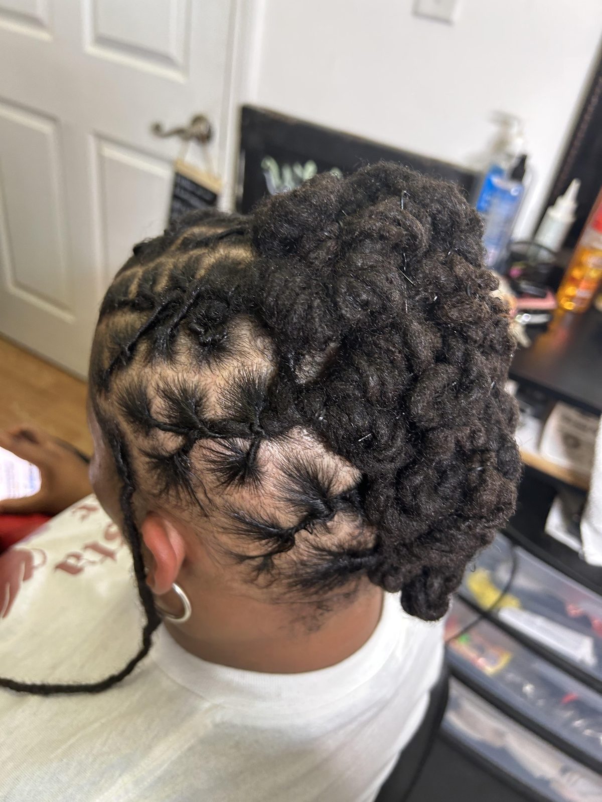 High-volume pinned loc updo with detailed crown styling by Jennifer J at LOC & Curl Xpress ATL Salon in Decatur, GA
