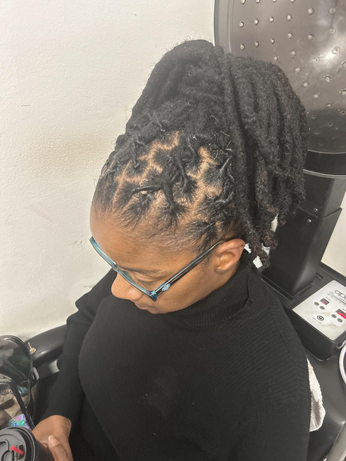 Sculpted high pompadour loc updo with crisp retwisted roots by Jennifer J at LOC & Curl Xpress ATL Salon in Decatur, GA