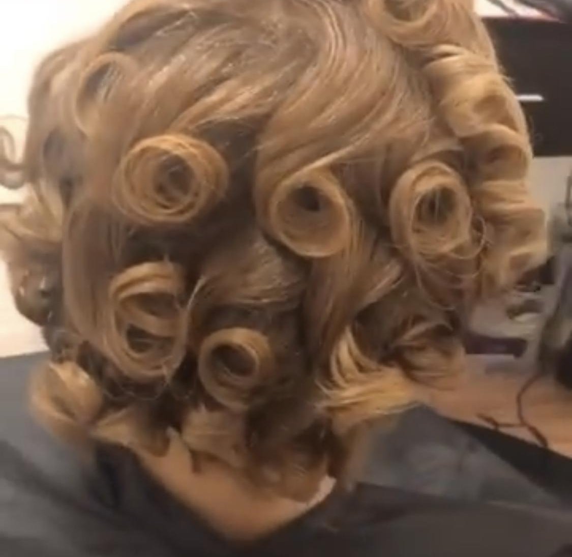 Defined golden blonde rod set curls by Jennifer J at LOC & Curl Xpress ATL Salon in Decatur, GA