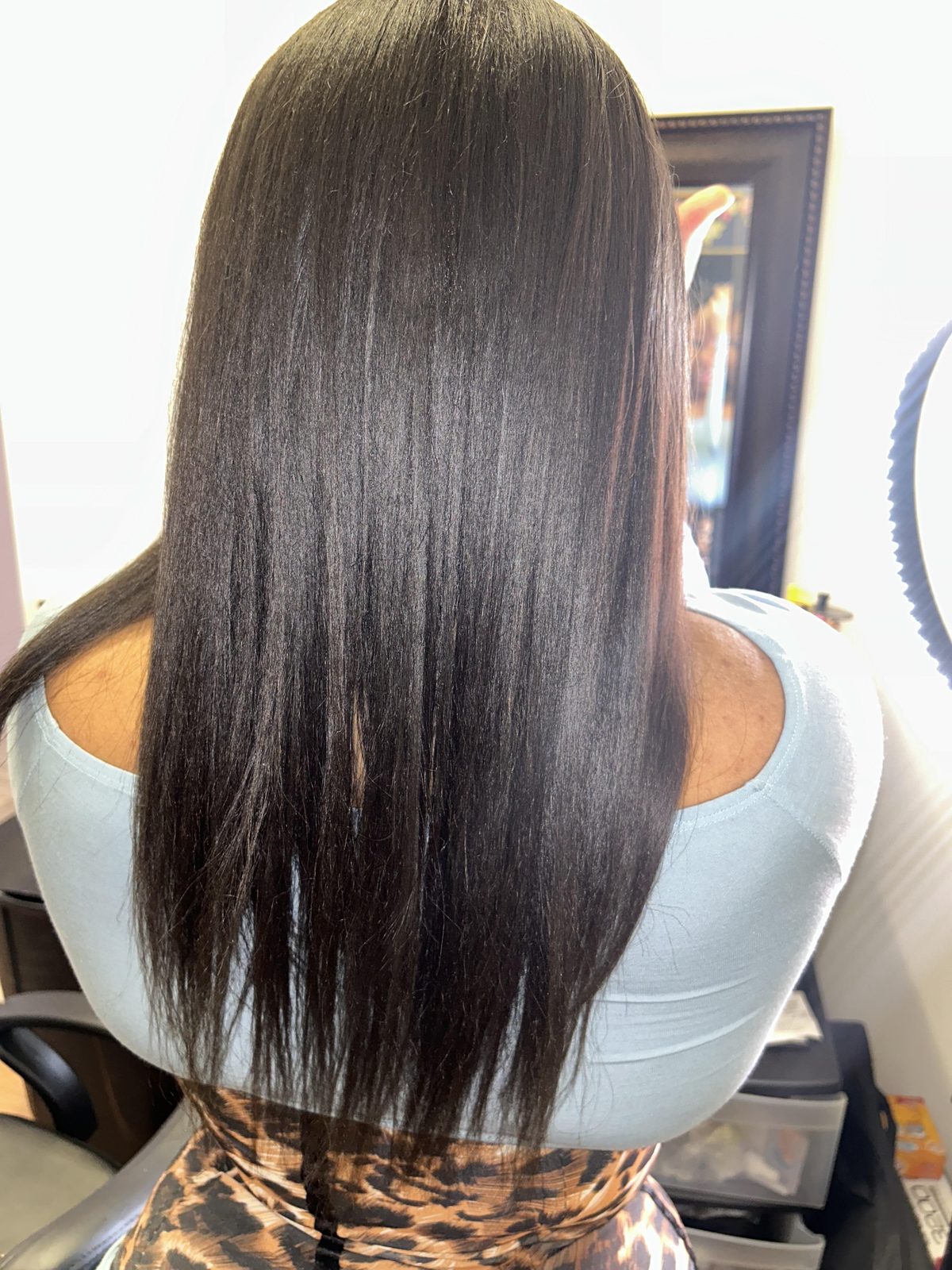 Silky smooth, high-shine long natural hair silk press by Jennifer J at LOC & Curl Xpress ATL Salon in Decatur, GA