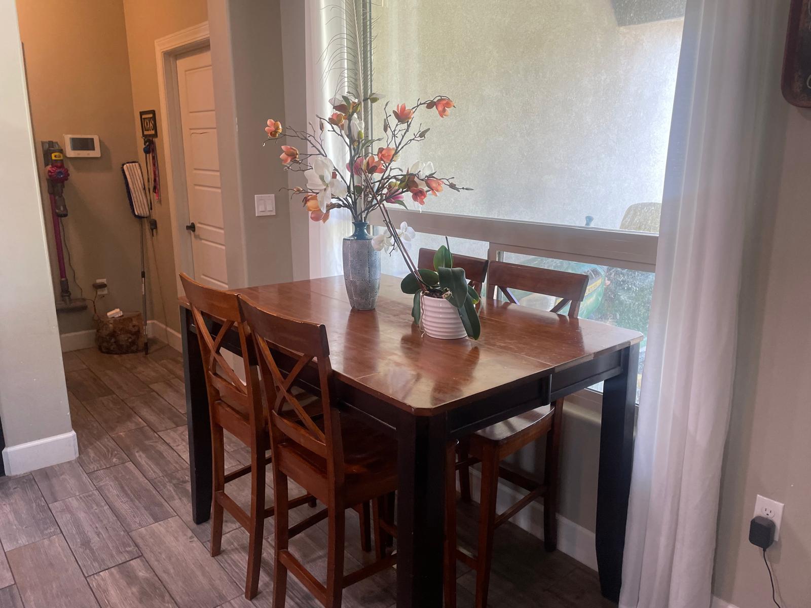 Spotless dining room table and window area cleaned by Adri's Cleaning Services in Hobbs NM