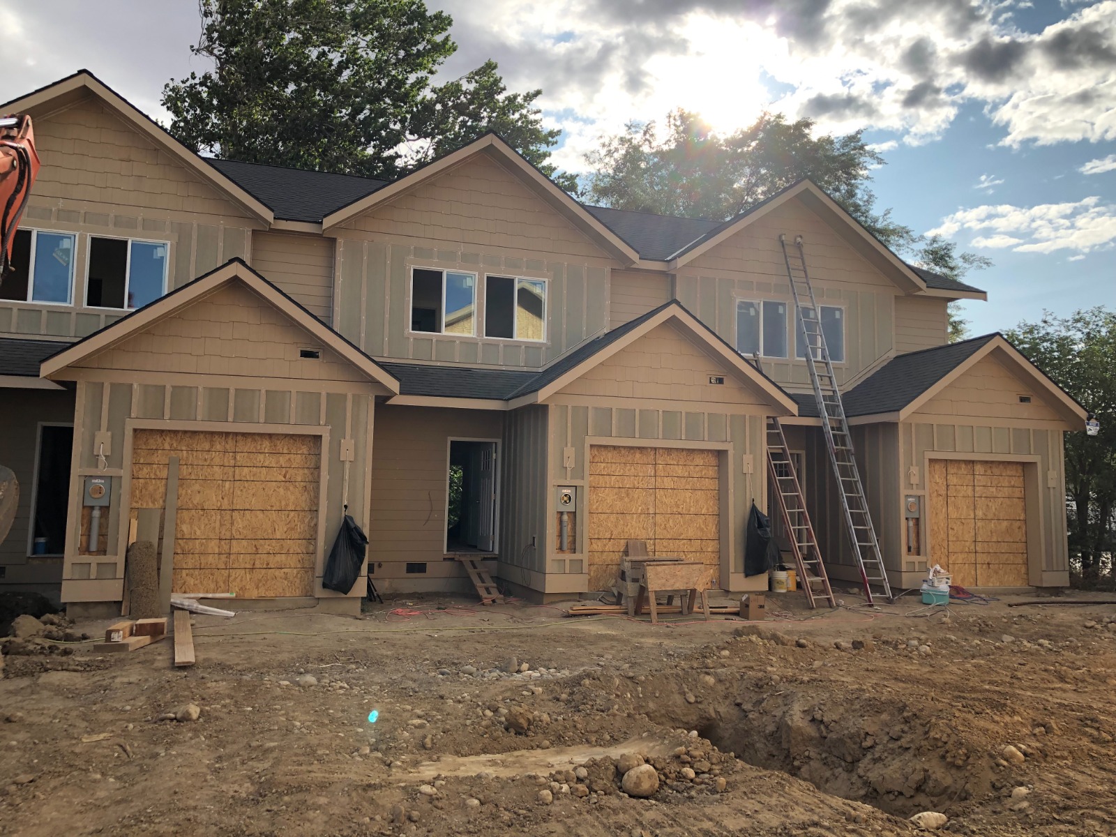 Multi-family townhome siding prep and exterior painting staging by Rivercrest Home Services LLC in Wenatchee WA