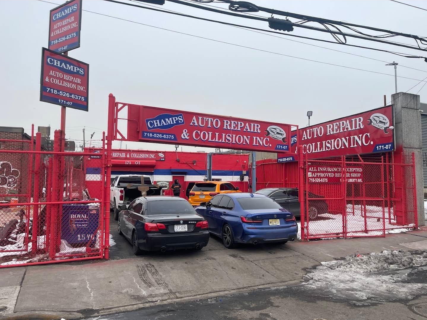 Champs Auto Repair & Collision gated facility and customer vehicle yard