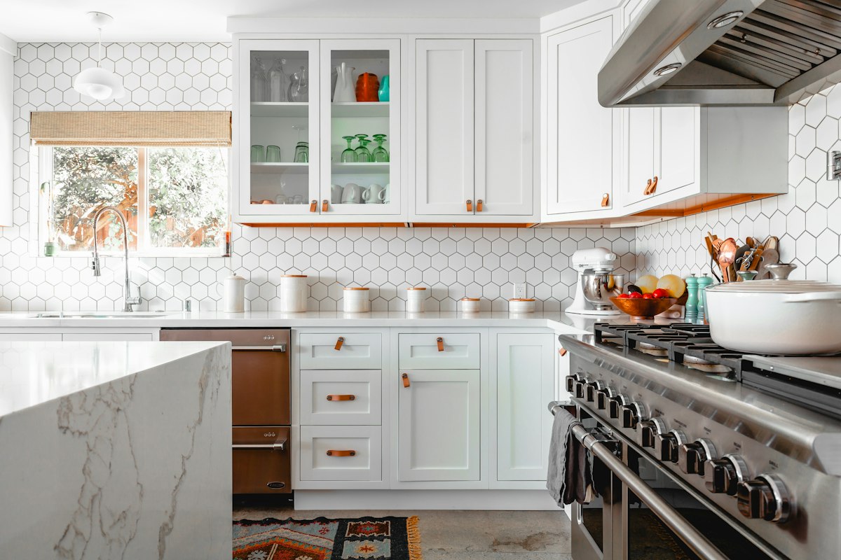 Factory-smooth painted white kitchen cabinets refinished in Tampa FL