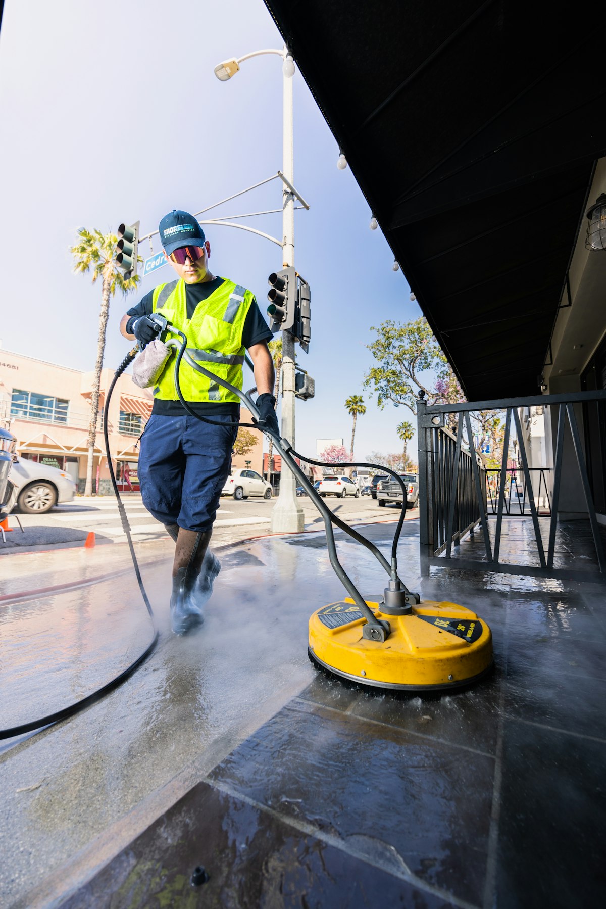 High-pressure surface cleaning of driveway and walkway by Ecuaconstruction Corp in Tampa FL