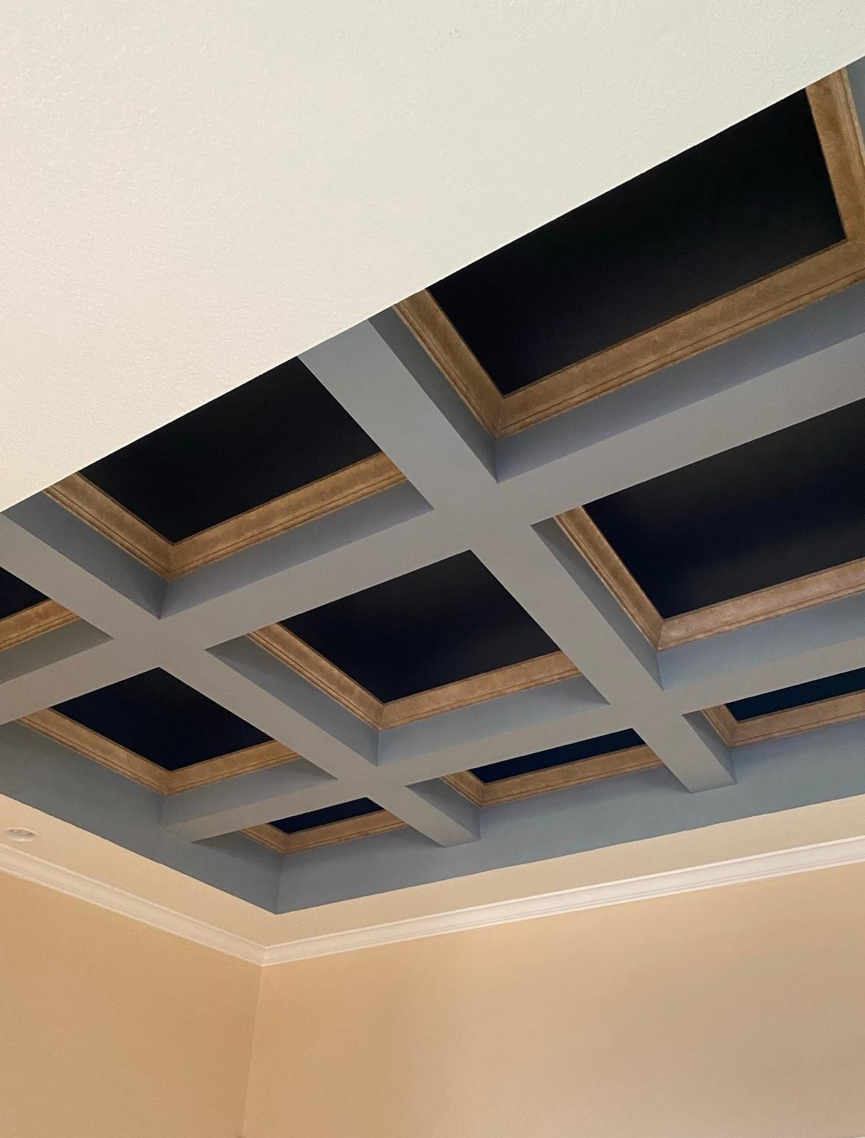 Custom coffer grid ceiling painted with precision grey beams, stained wood inner trim, and rich matte black recess panels in Tampa Bay FL