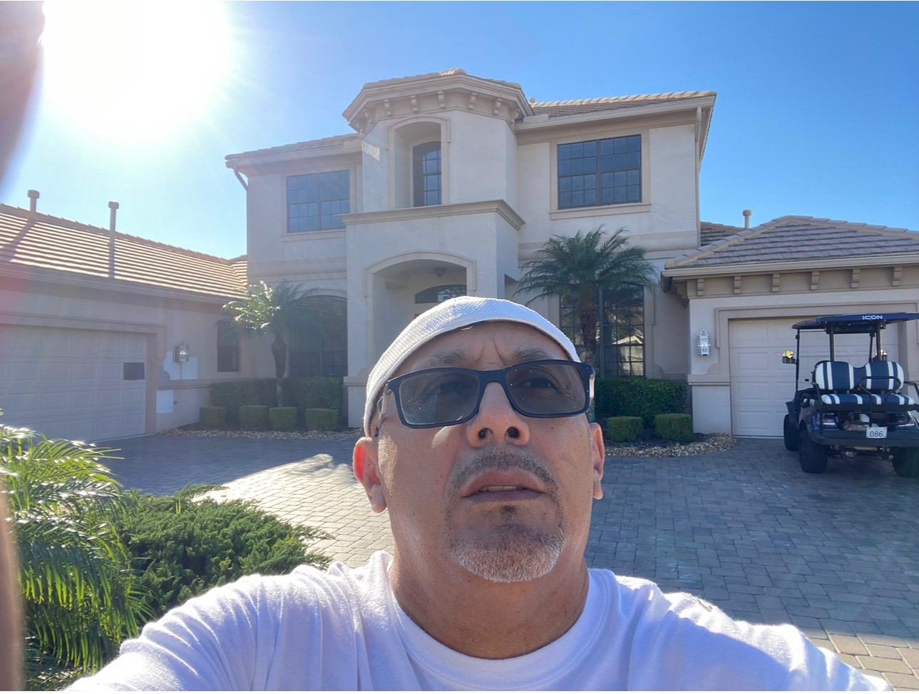 Ecuaconstruction Corp founder John Granda on-site overseeing a two-story luxury Florida estate project in Land O' Lakes FL