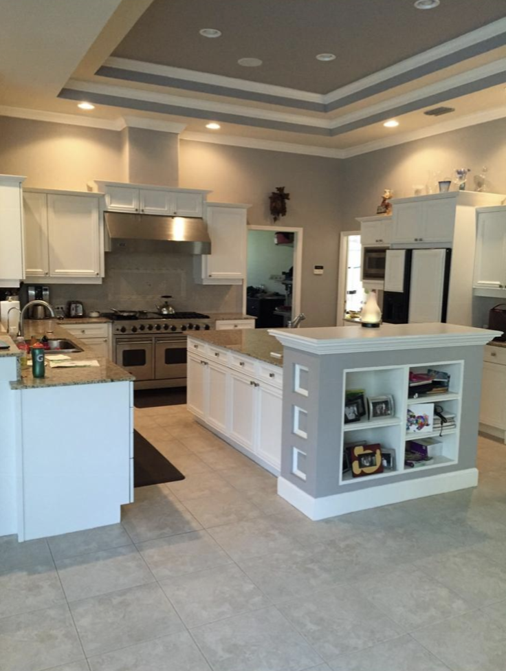 Painted white kitchen cabinets refinished by Ecuaconstruction Corp in Tampa FL