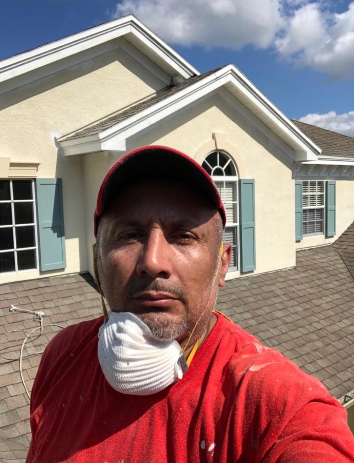 Ecuaconstruction Corp owner John Granda working on-site performing roofline inspection and precision exterior prep in Land O' Lakes FL