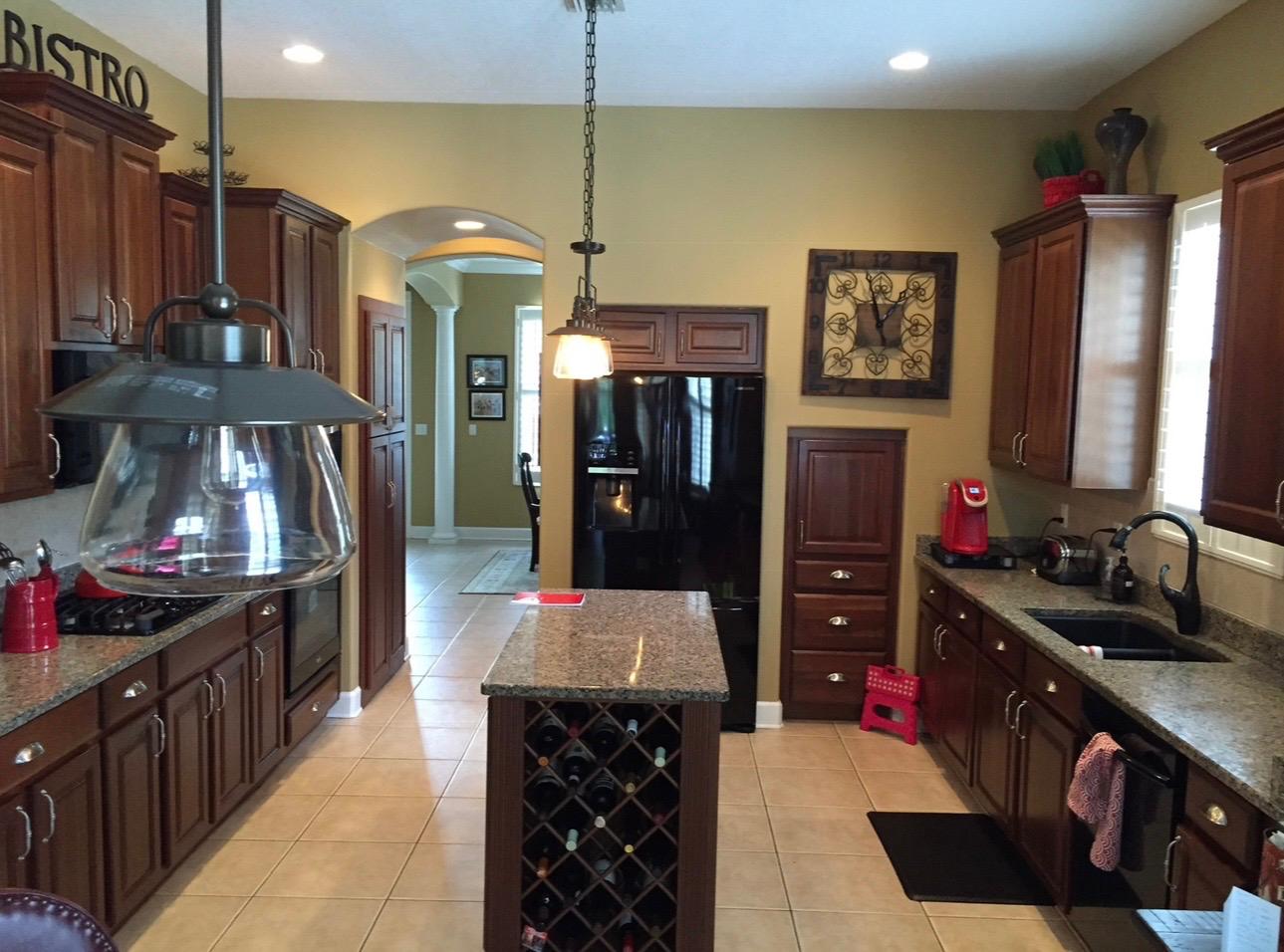 Kitchen custom wood cabinetry and interior painting project in Land O' Lakes FL