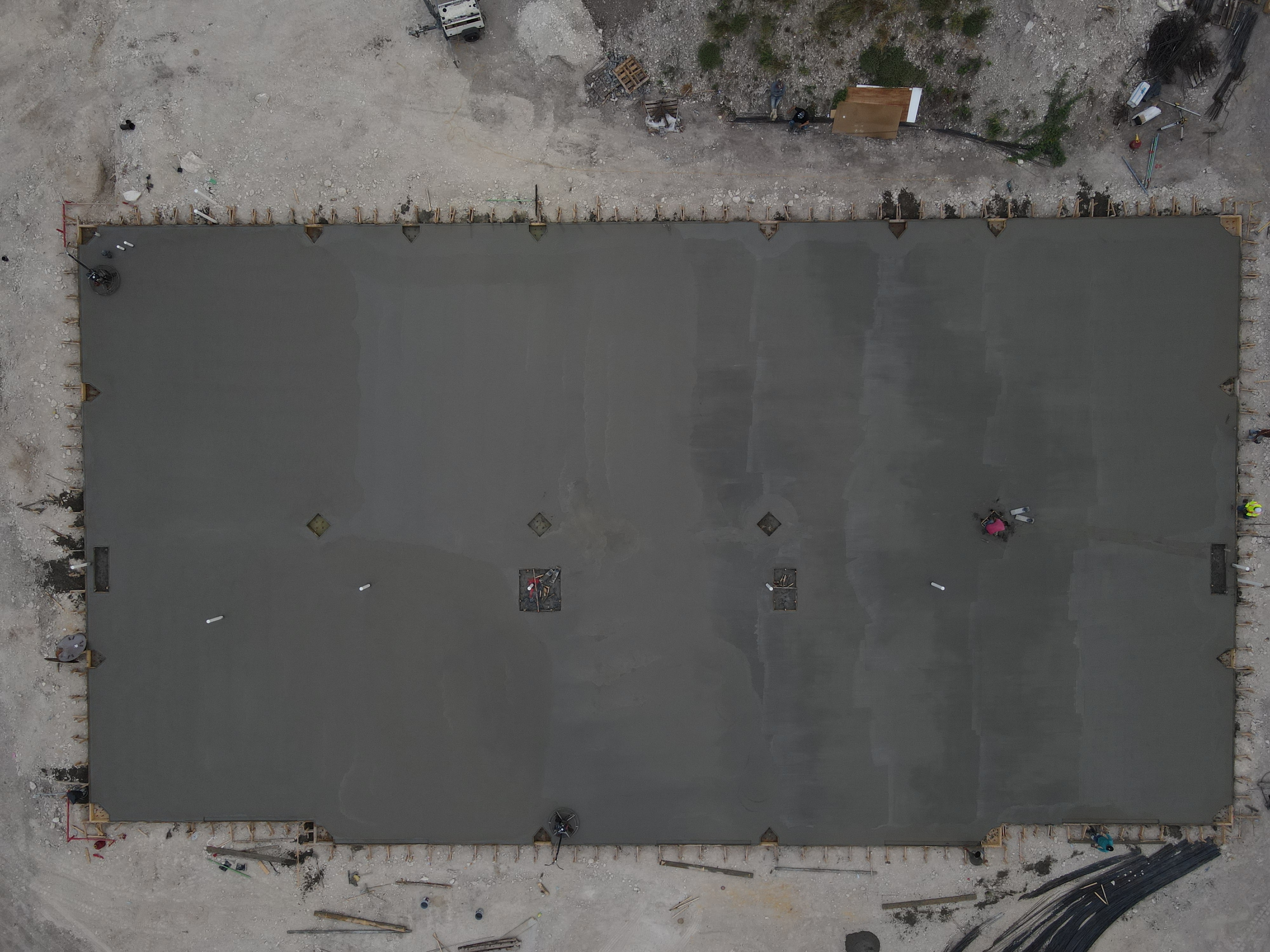 Direct overhead aerial view of finished industrial concrete slab by JIC Concrete LLC