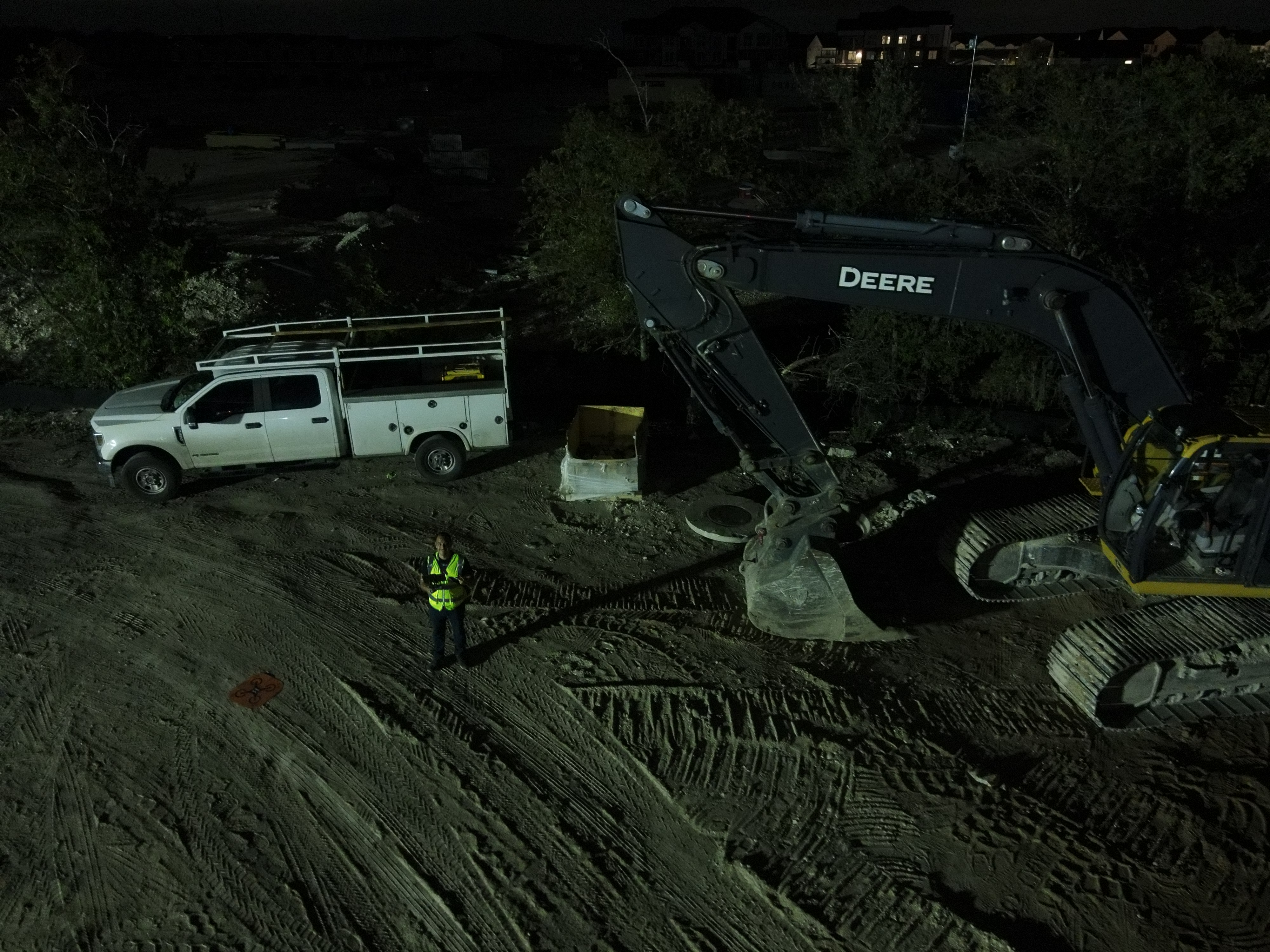 Heavy commercial John Deere excavator and site prep equipment at a JIC Concrete job site in Texas