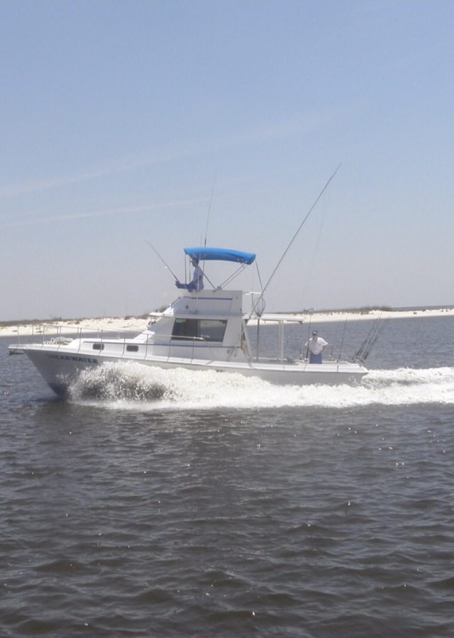 The Shearwater charter boat running past a Mississippi barrier island