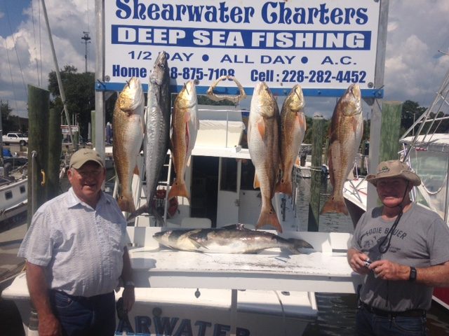 Two anglers with redfish, king mackerel and cobia from a 10-hour fishing trip in Biloxi