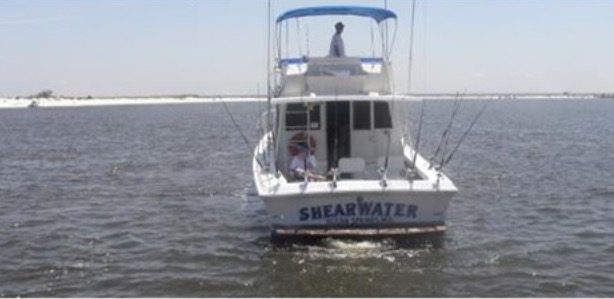 Stern view of the Shearwater charter fishing boat on the Mississippi Sound near Biloxi