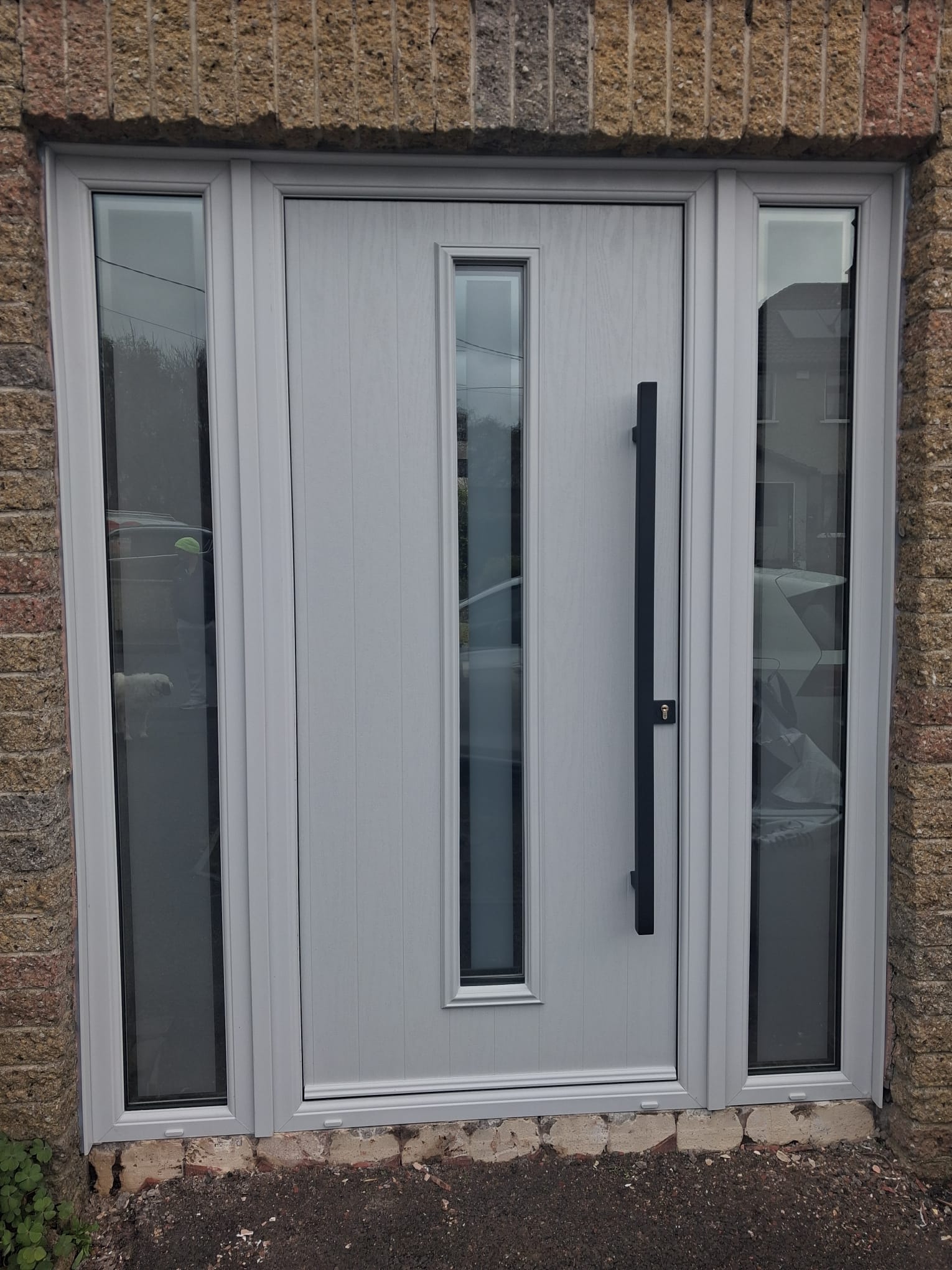 Contemporary Light Grey Composite Door with Black Pull Bar & Twin Sidelights