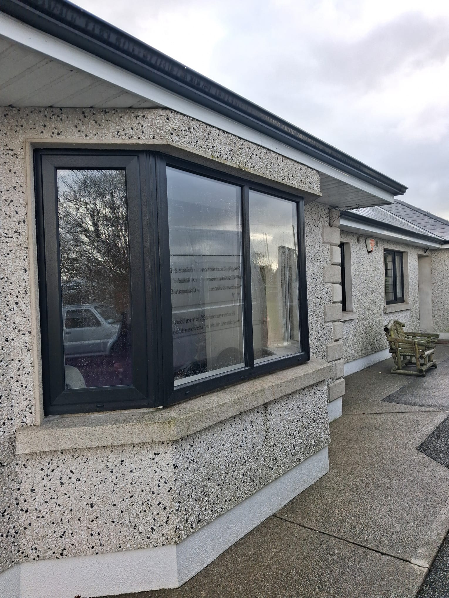 Anthracite Bay Window Installation on Pebble-Dash Bungalow